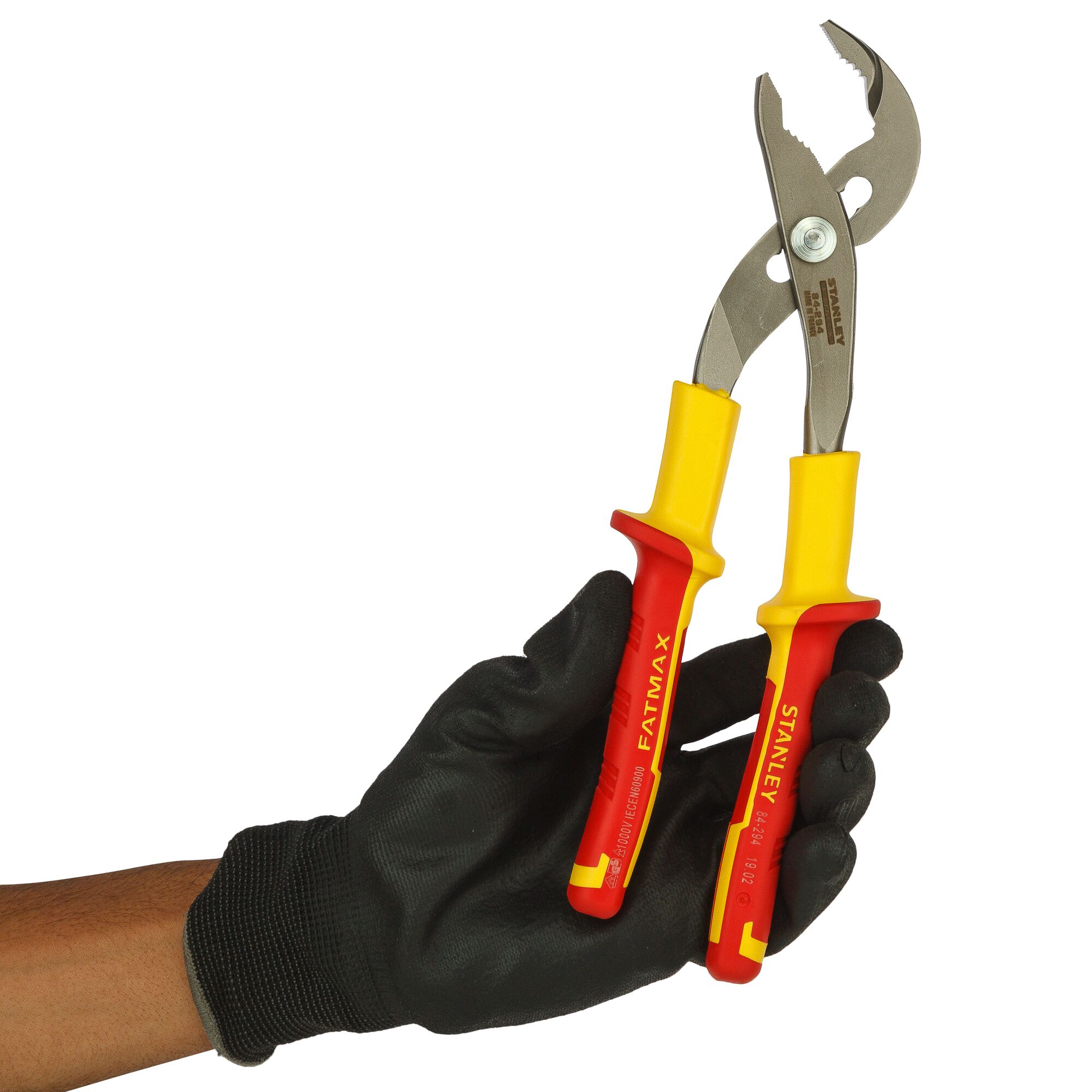 A gloved hand holds Stanley insulated pliers with yellow and red handles, suitable for electrical work.