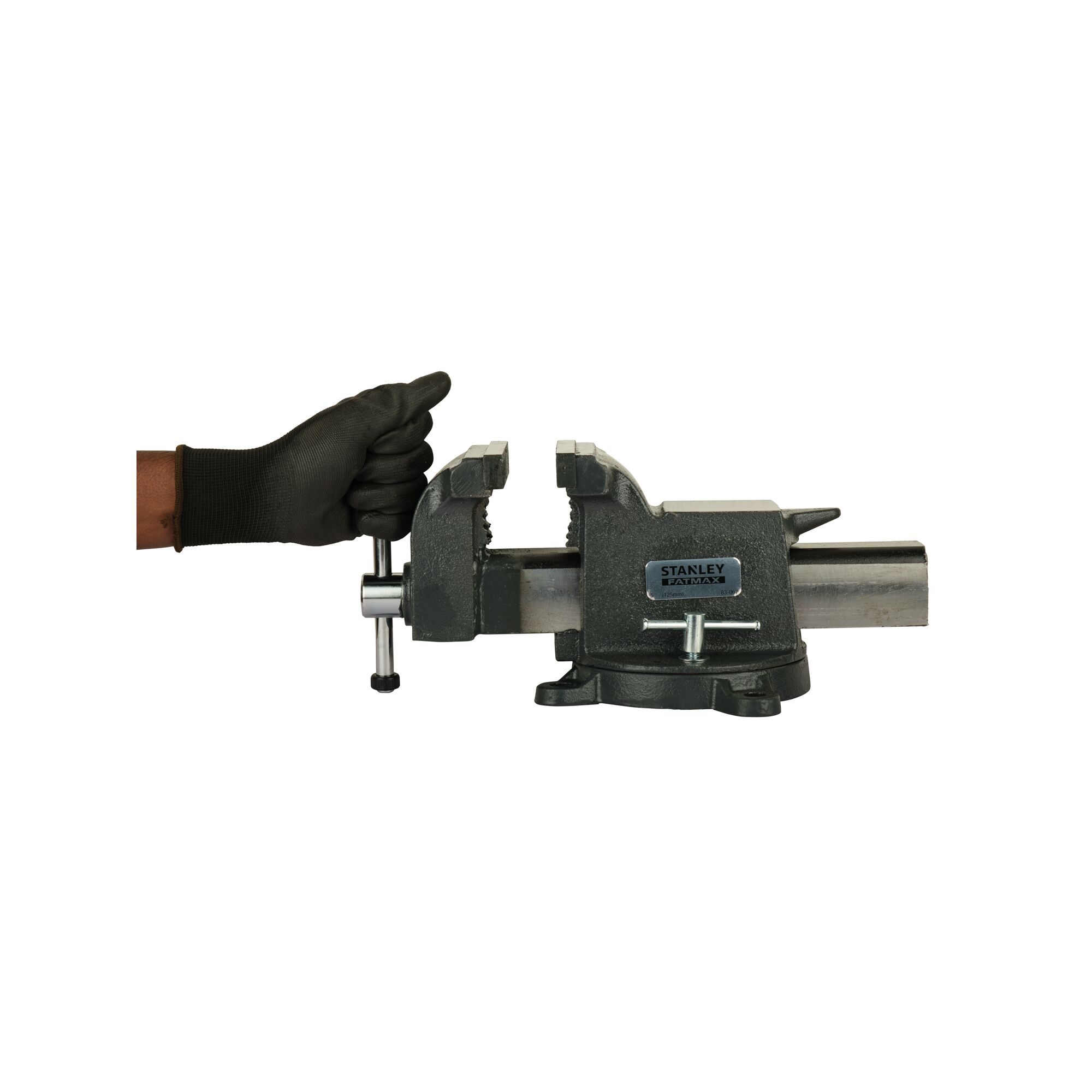 Photo of STANLEY 83-067 bench vise on white background, gloved hand turning handle.
