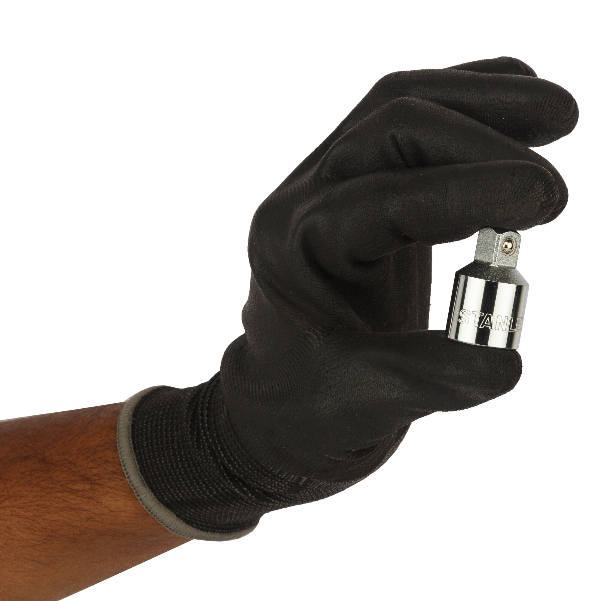 STANLEY 1-86-414 socket adapter held by a gloved hand, close-up, silver chrome finish.