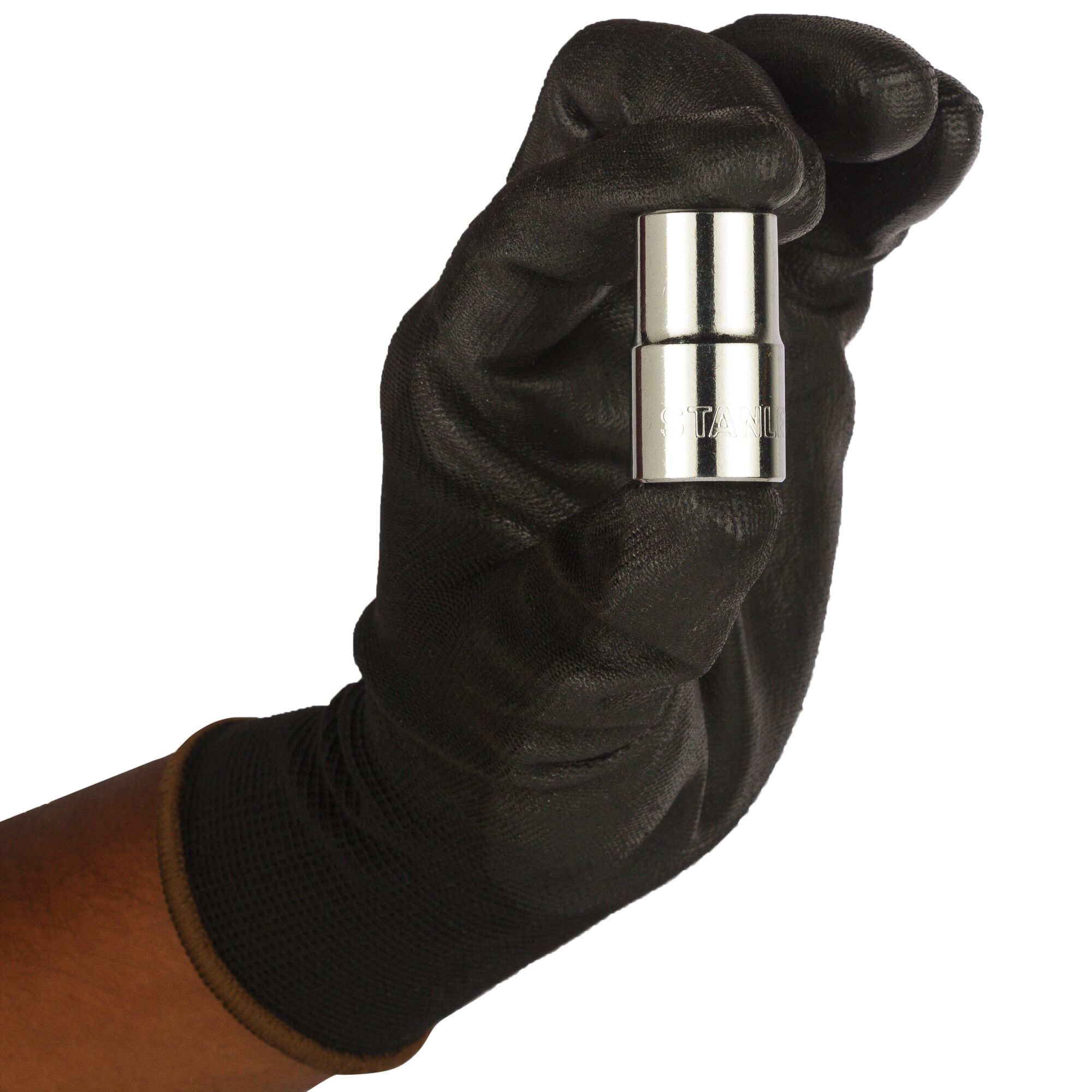 A gloved hand holding a small, shiny Stanley socket tool. The tool is cylindrical and metallic.