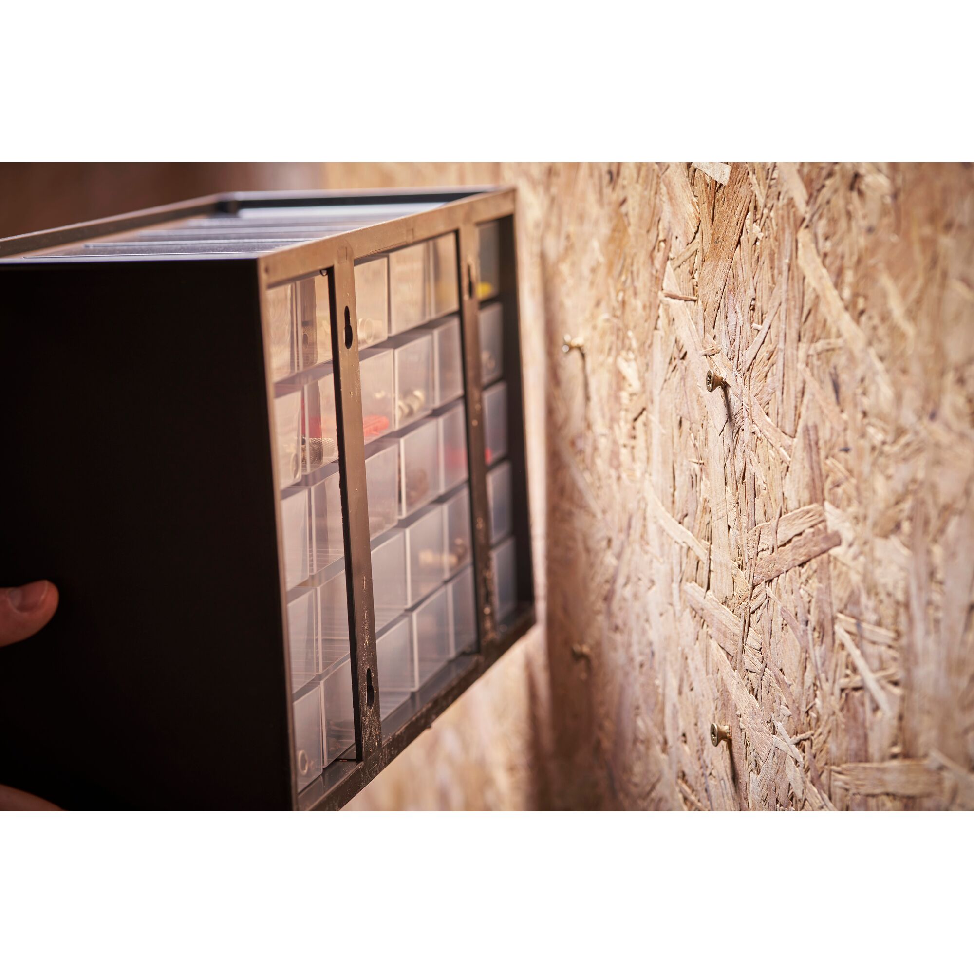 STANLEY 1-93-980 wall-mounted small parts organizer with clear drawers, angled side view.