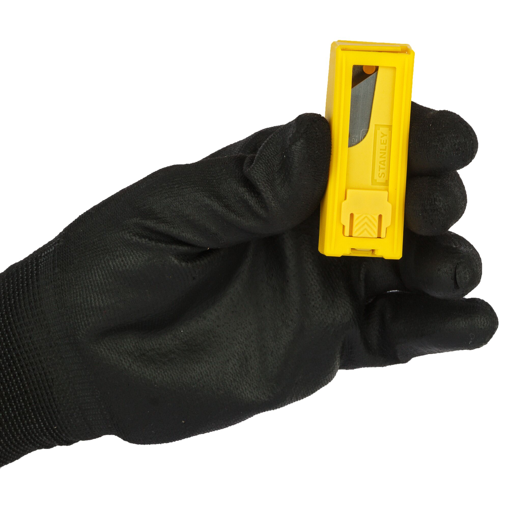 Photo of STANLEY 11-921H utility blade dispenser held in a gloved hand, yellow plastic casing, front view.