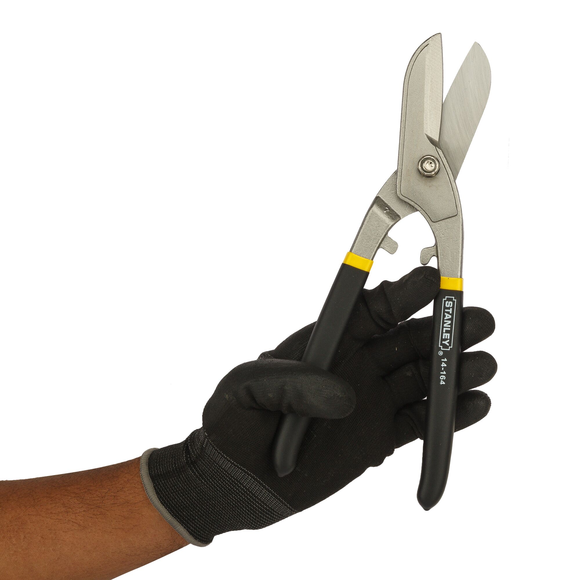 Photo of STANLEY 14-164 aviation snips with black handles held in a gloved hand, product category photography
