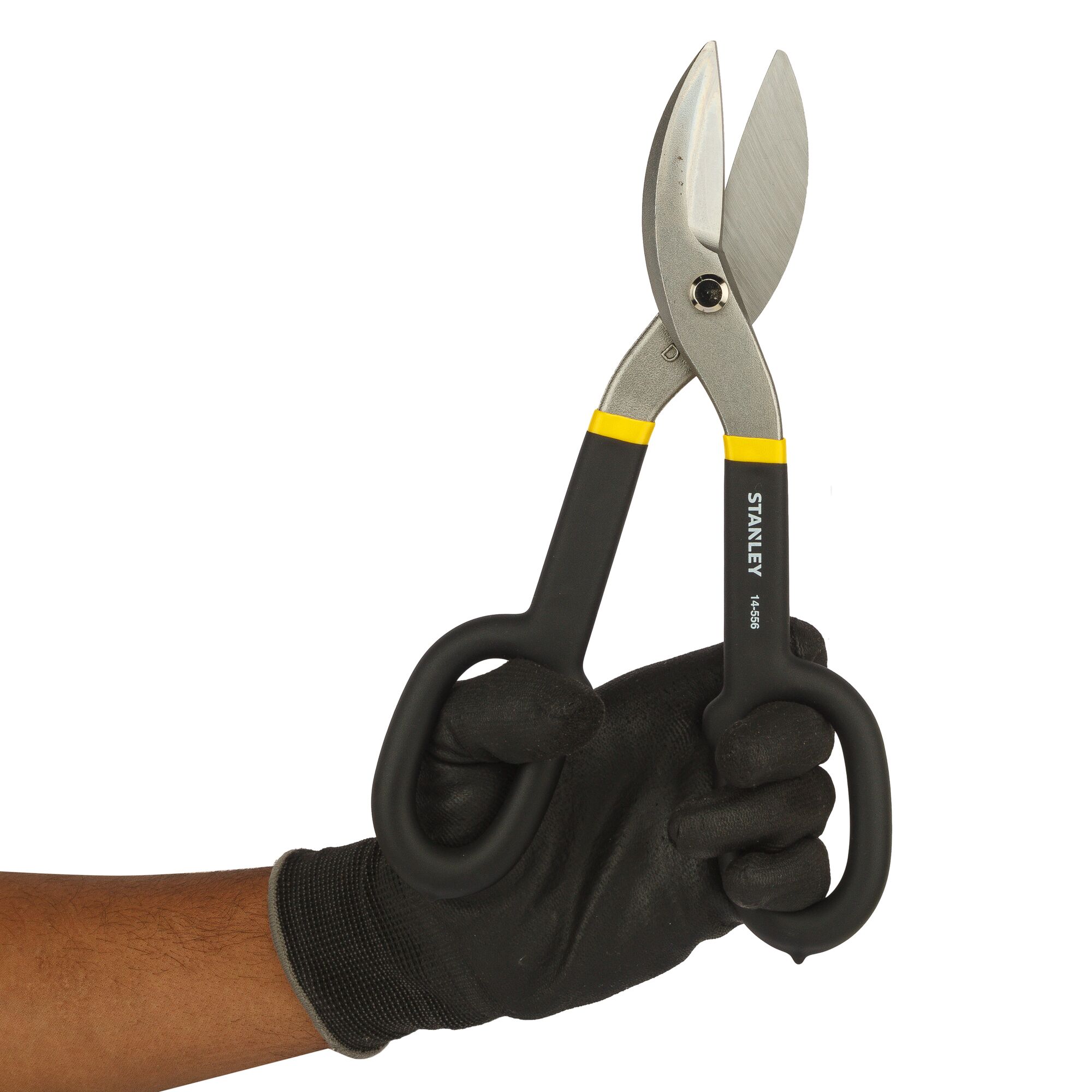 Photo of STANLEY 2-14-556 aviation snips with black handles held in a gloved hand, side view on white background.