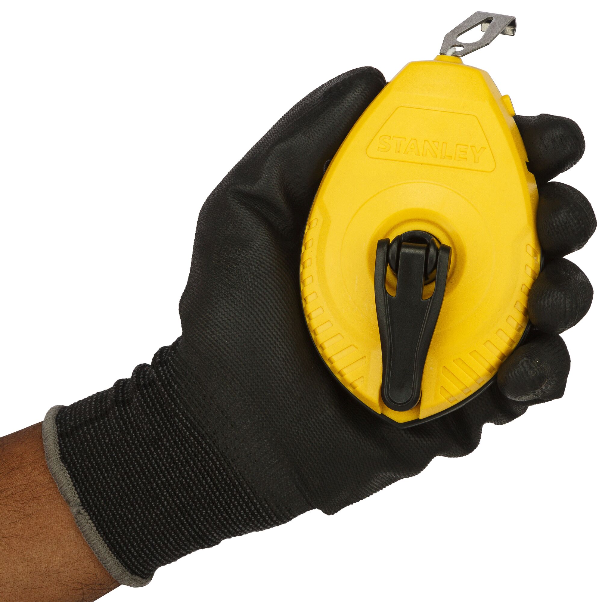 Photo of STANLEY 47-443 chalk line reel in yellow, held in a gloved hand, front angle view.