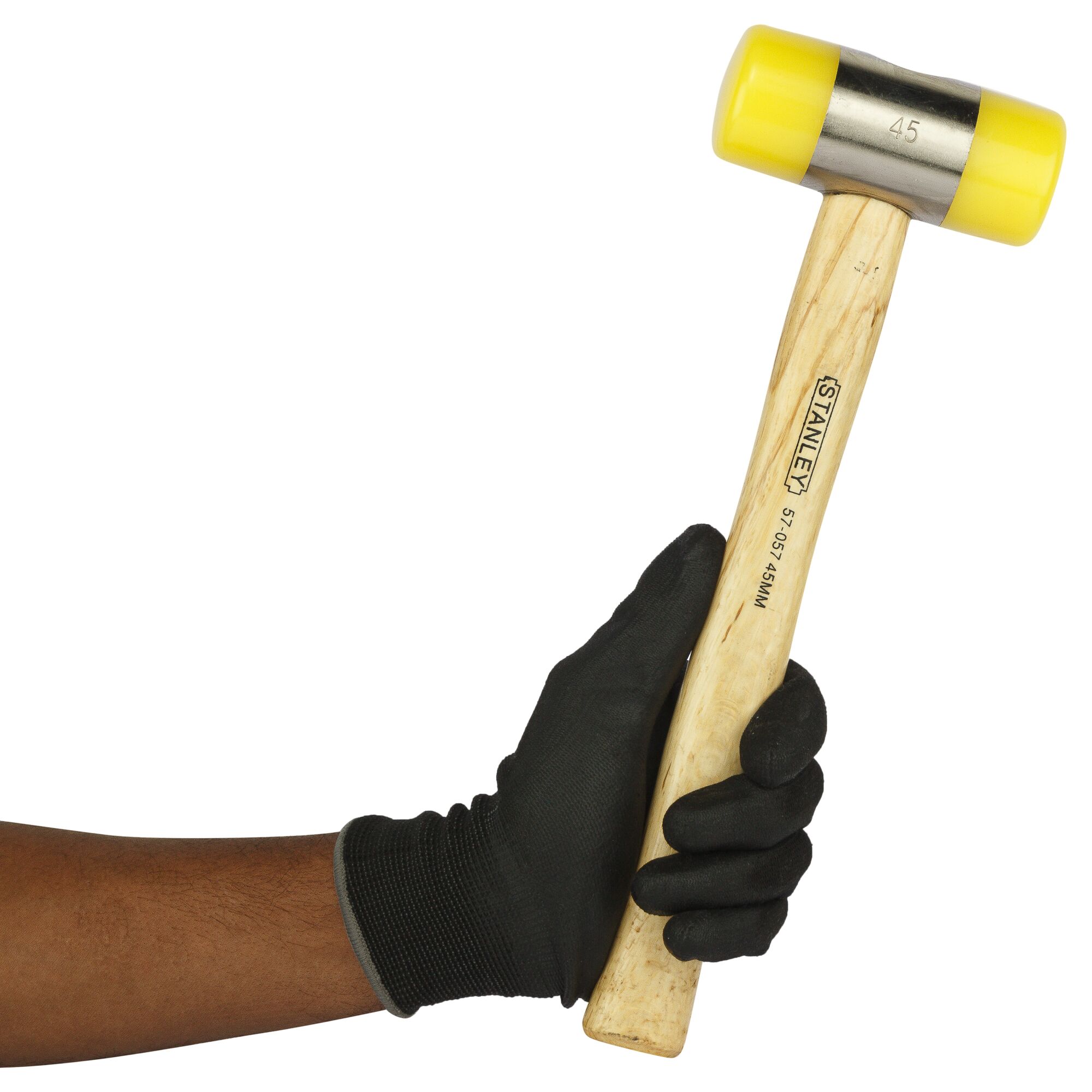 Stanley 57-057 mallet with yellow ends and wooden handle held in gloved hand, side angle.