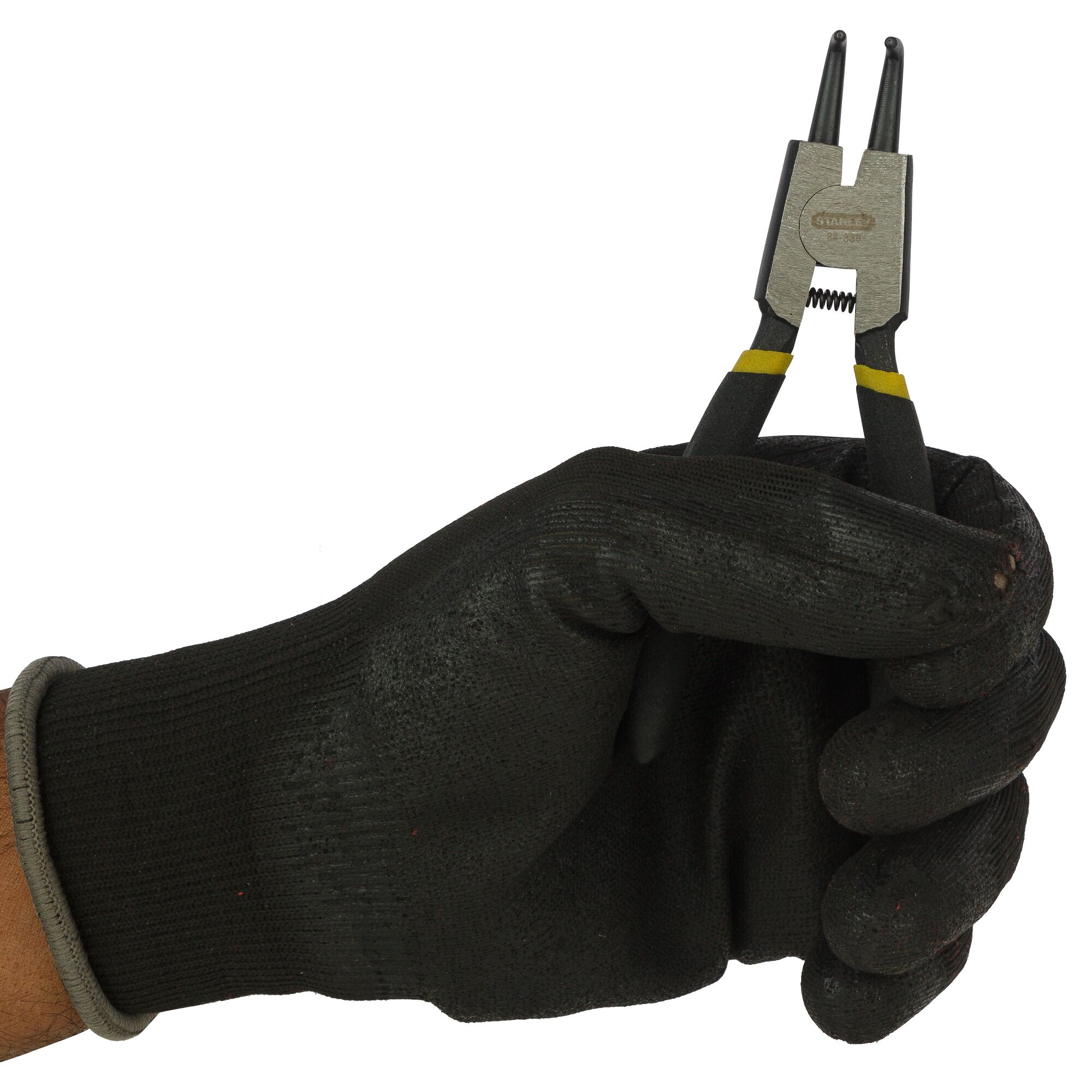 Photo of STANLEY 84-338-23 pliers held in a black glove, side angle, silver and black handle with yellow bands.