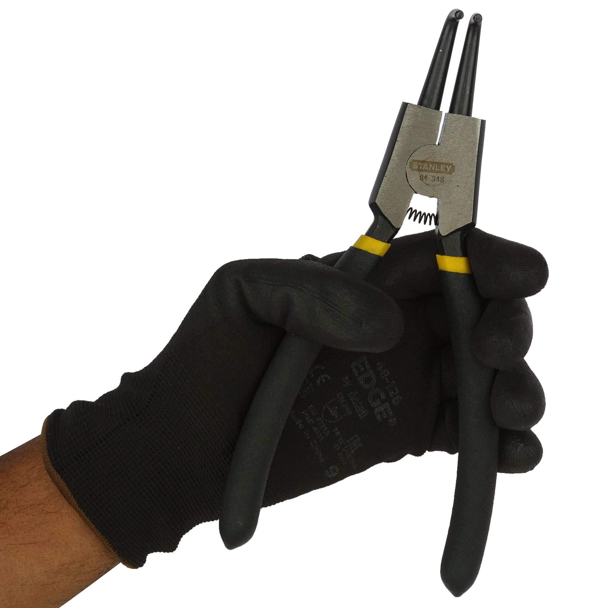 Stanley 84-348-23 snap ring pliers held in a gloved hand, front angle, black handles, yellow accents.
