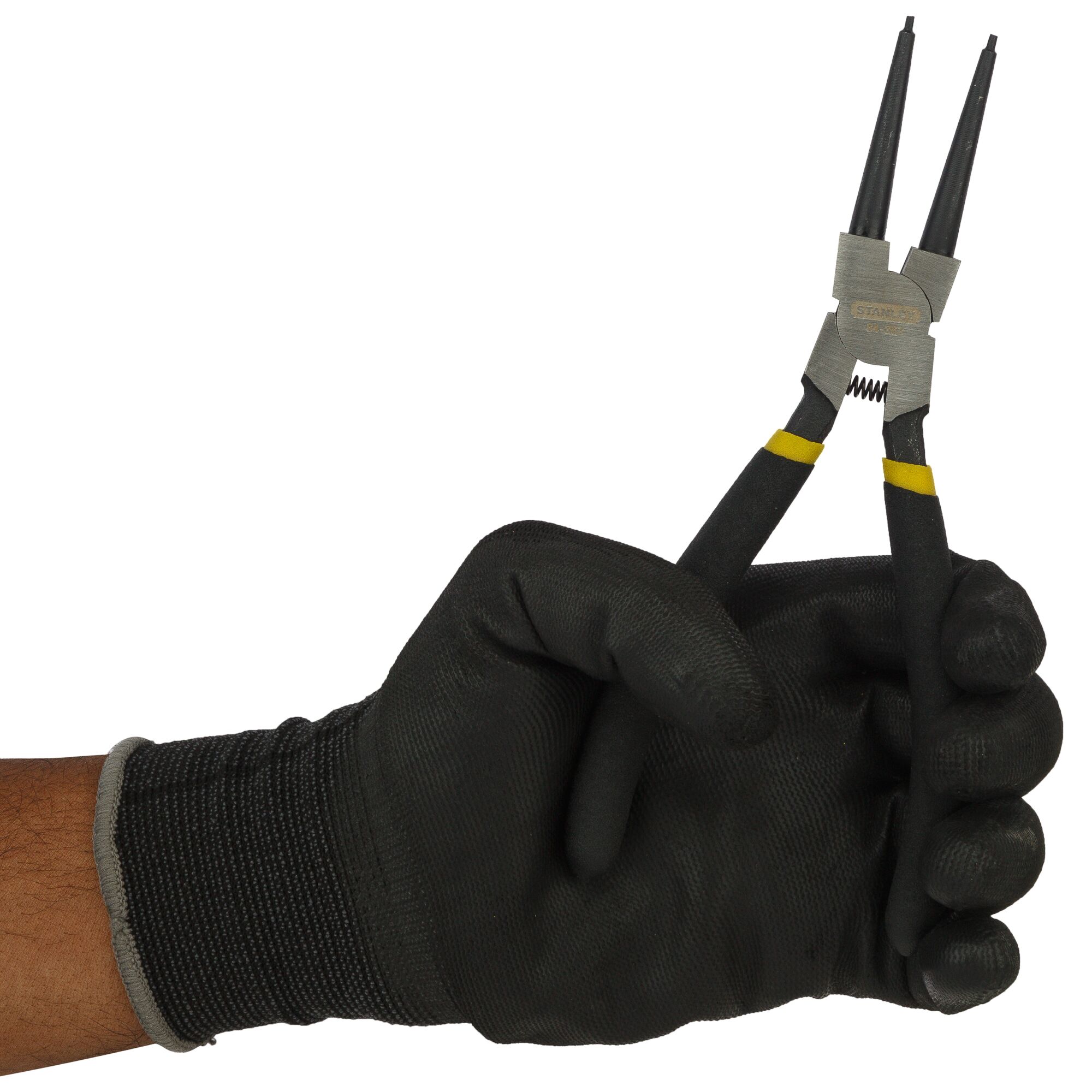 Gloved hand holding Stanley branded long nose pliers with black handles and yellow accents.