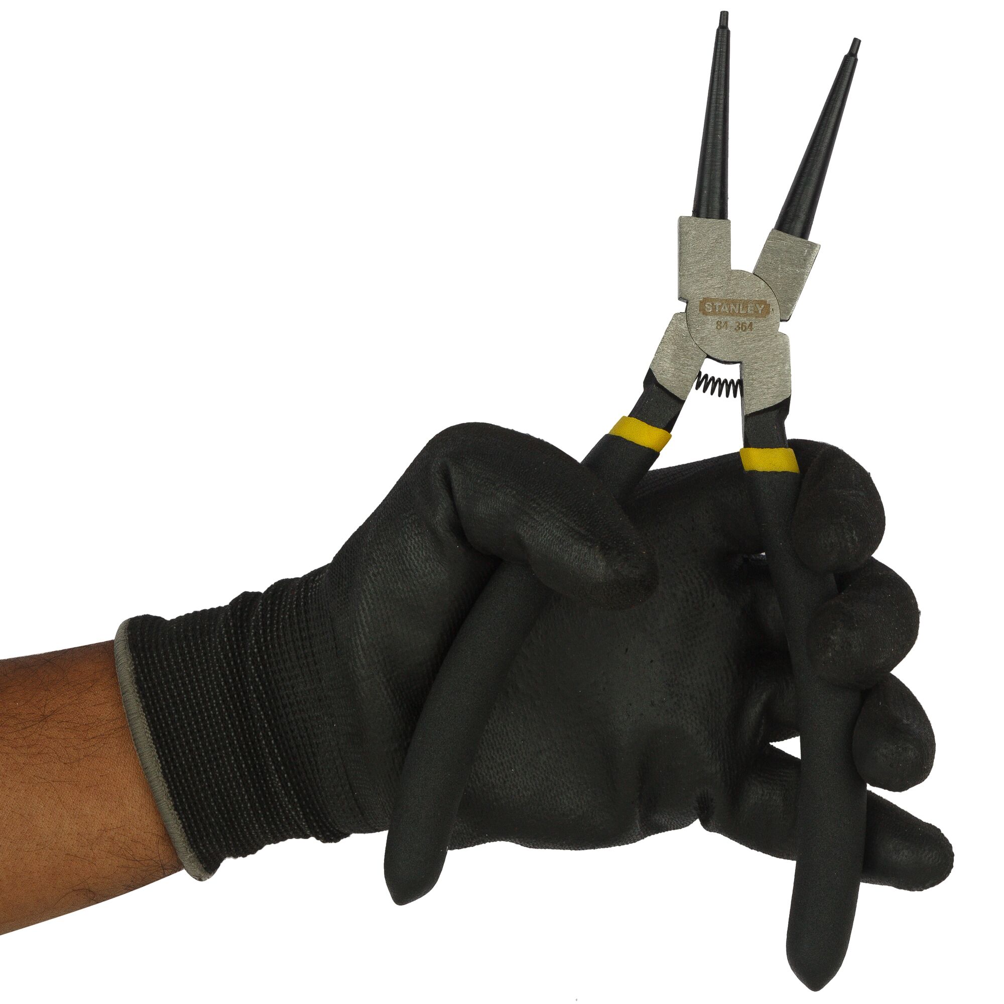 Stanley 84-364-23 black-handled circlip pliers held in gloved hand, front angle, photography product.