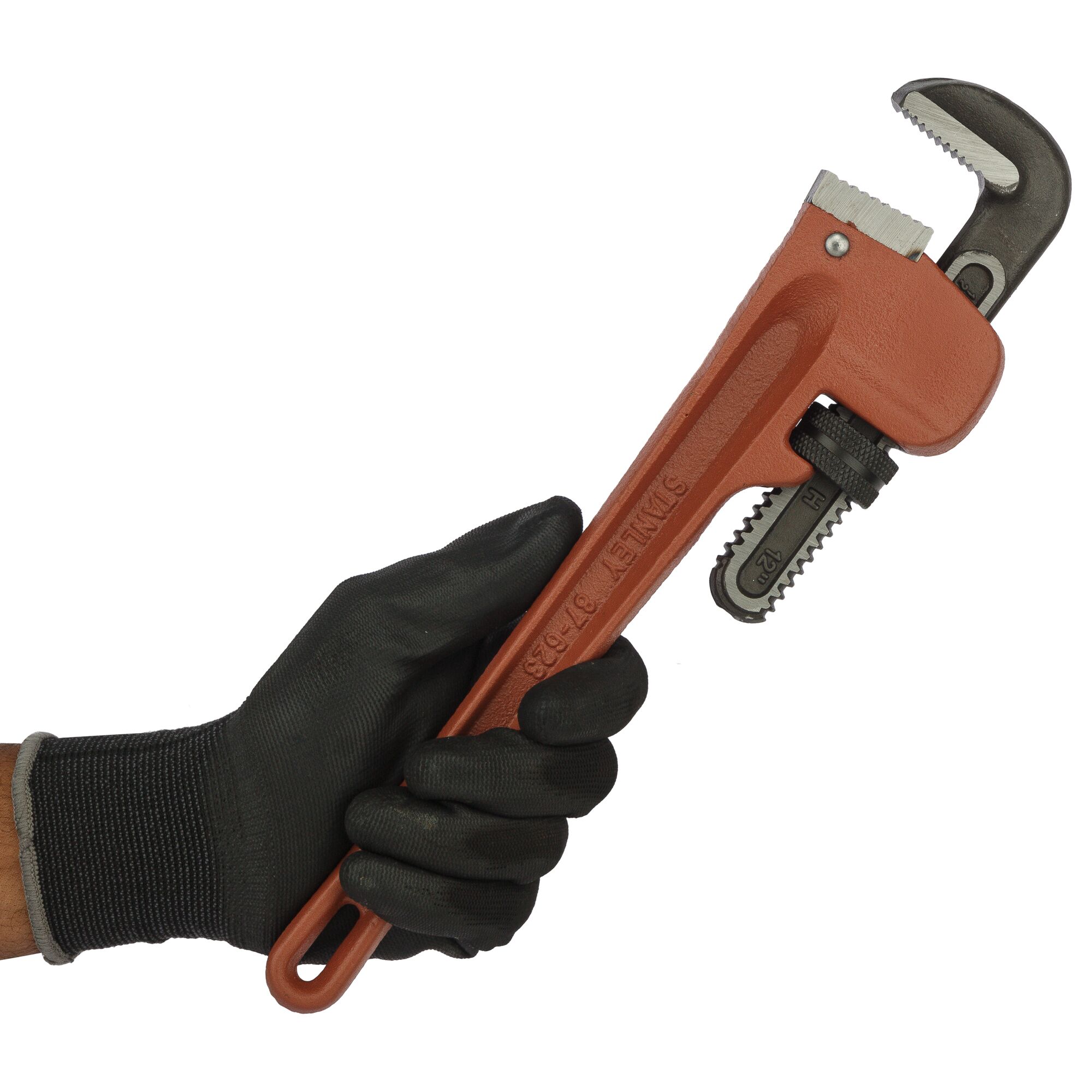 STANLEY 87-623-23 pipe wrench held in gloved hand, side angle, red handle and black jaw visible.