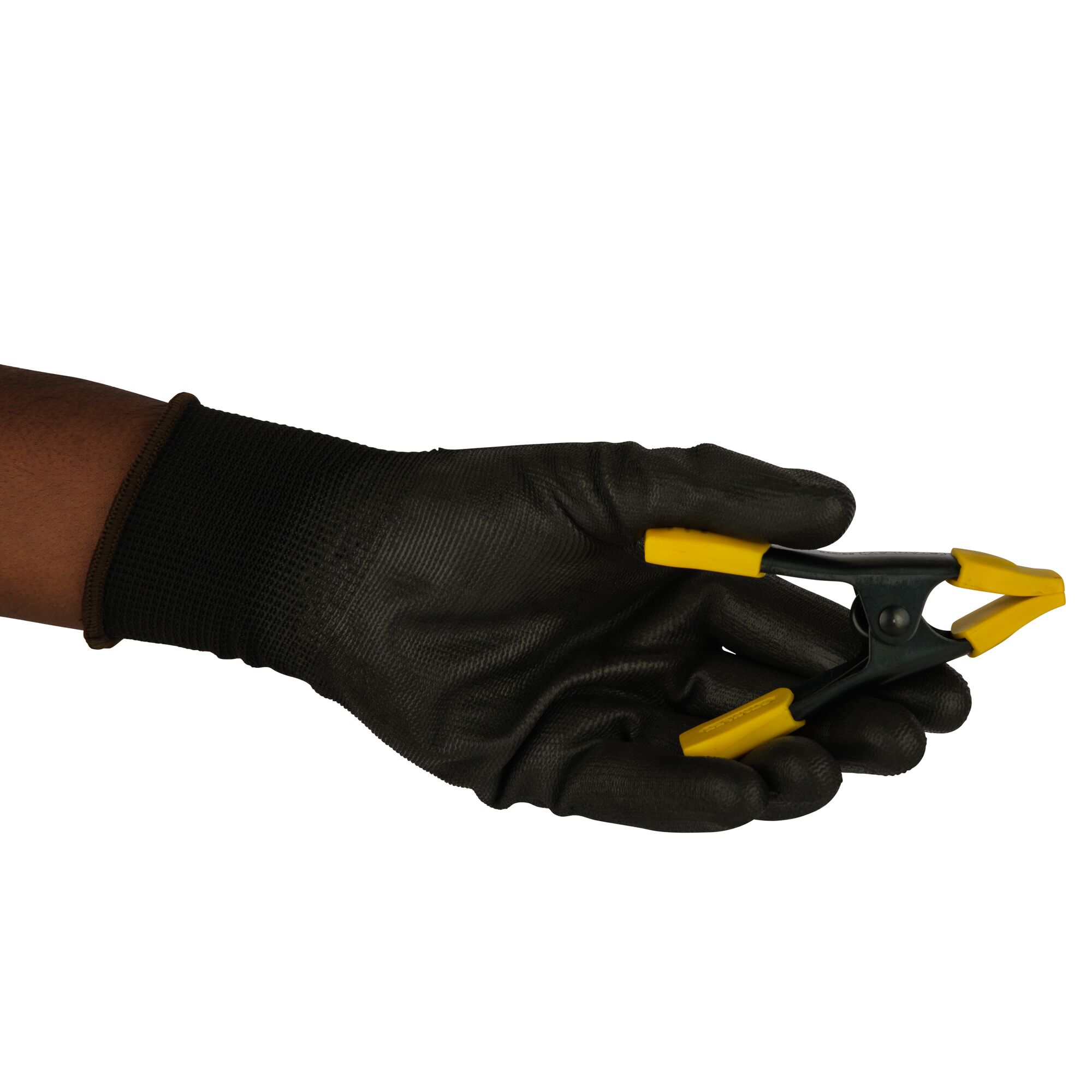 Stanley 9-83-079 photography of black glove holding yellow-handled clamp, side angle.
