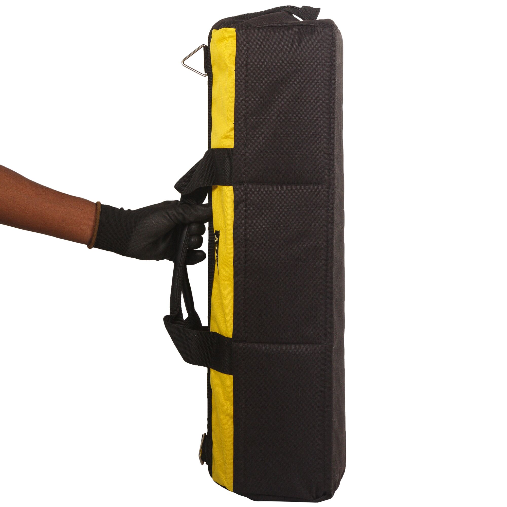 A hand in a black glove holding a yellow and black Stanley carrying case, shown vertically against a white background.