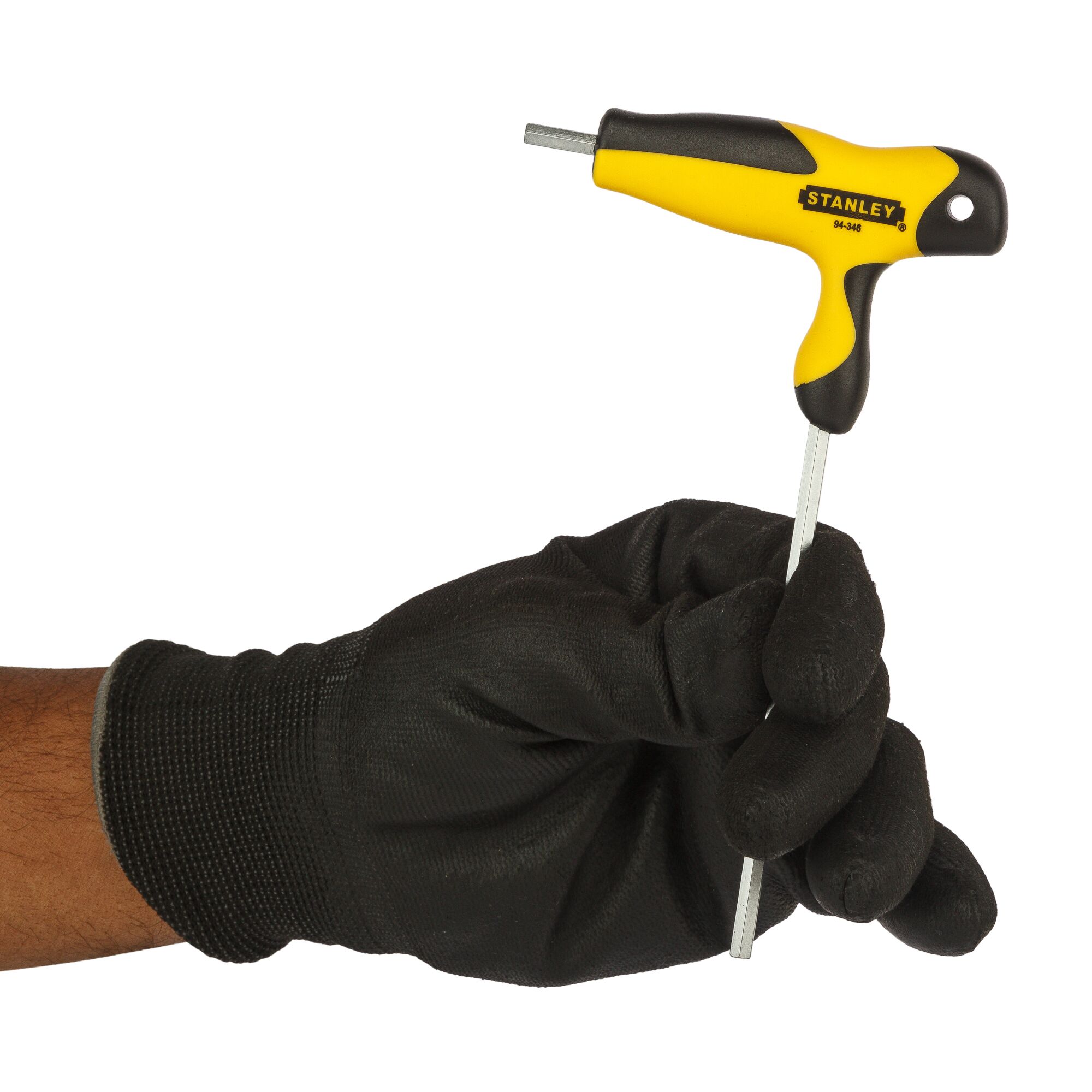 STANLEY 94-346 T-handle hex key in yellow and black, held by a gloved hand, front angle.