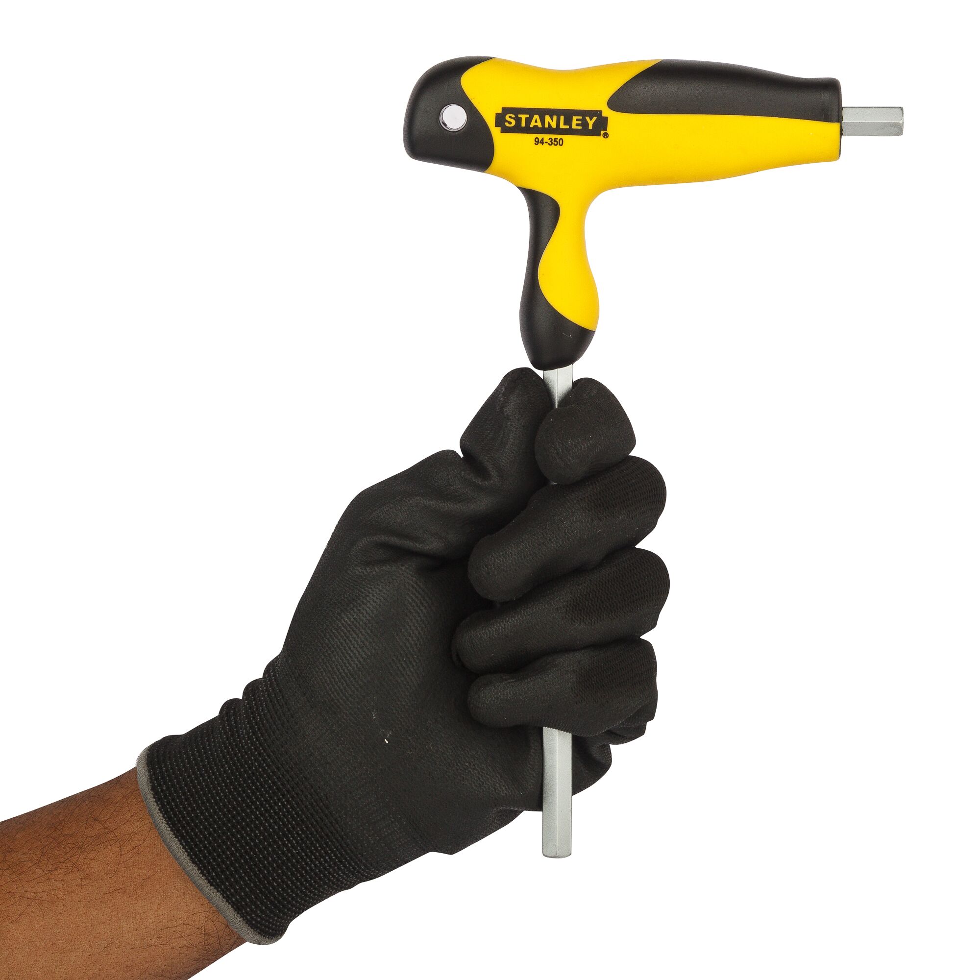 Gloved hand holding a Stanley 94-350 T-handle hex key with yellow and black grip.