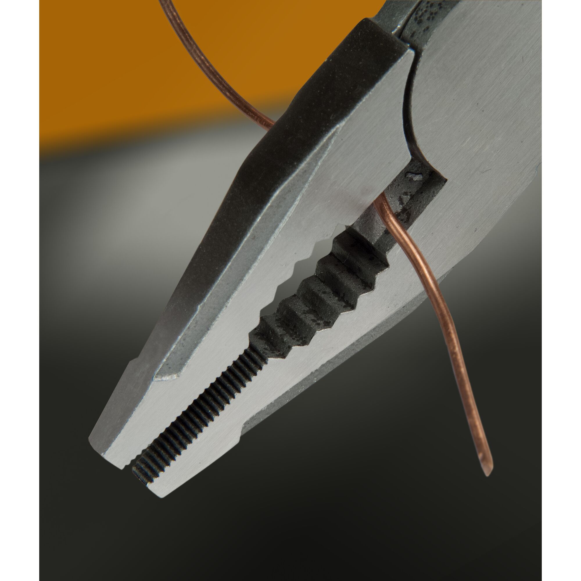 STANLEY FMHT0-72414 pliers gripping copper wire, close-up photography.