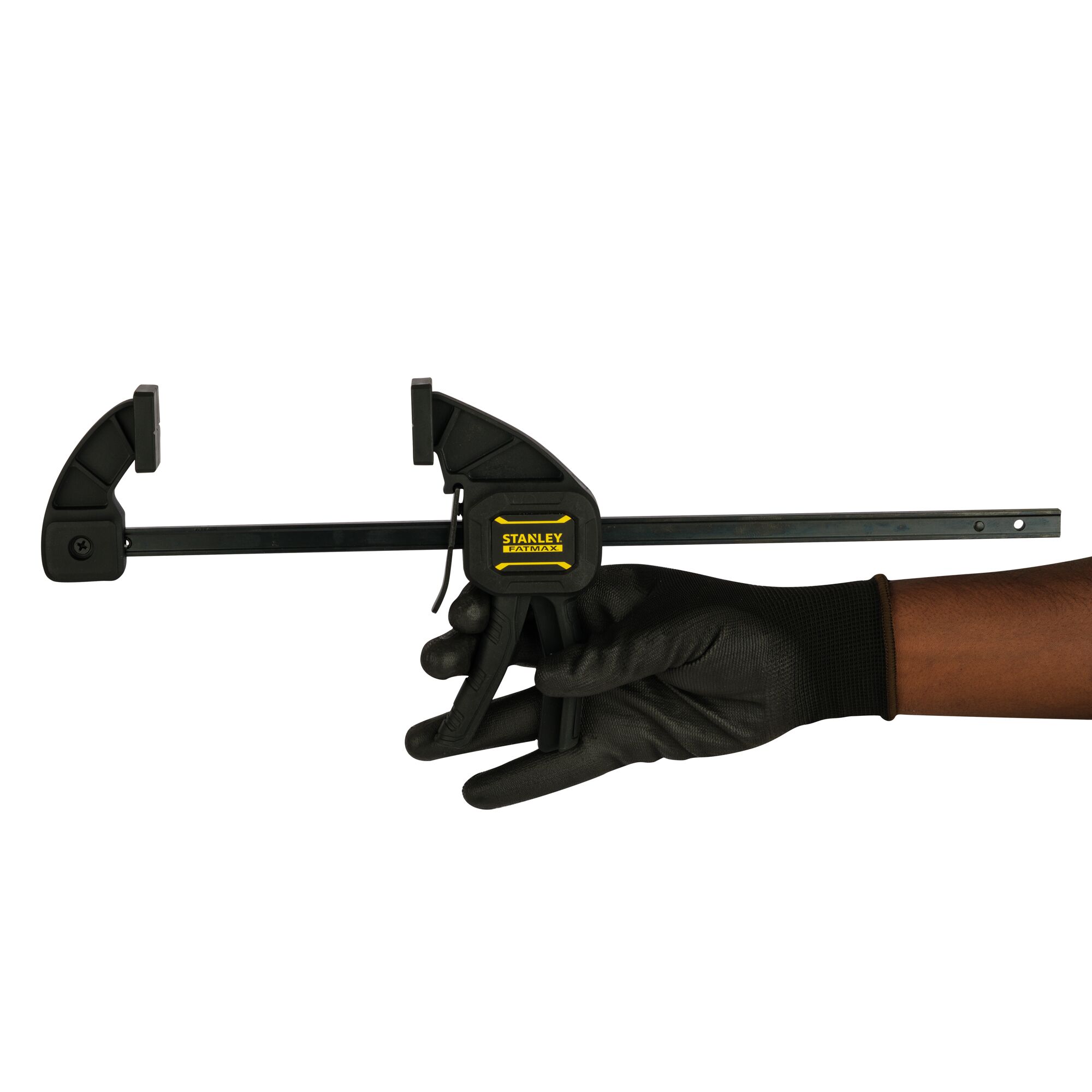 Stanley FMHT0-83233 bar clamp held by a gloved hand, side angle with white background.