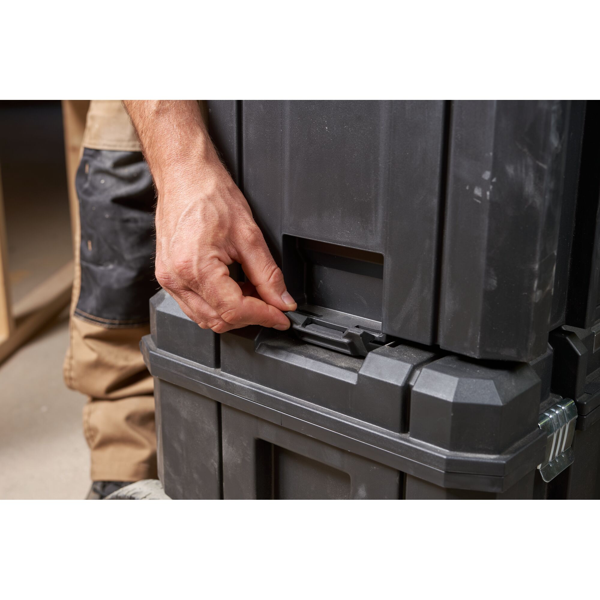 STANLEY FMST1-75753 tool box close-up, hand opening latch, black plastic storage case.