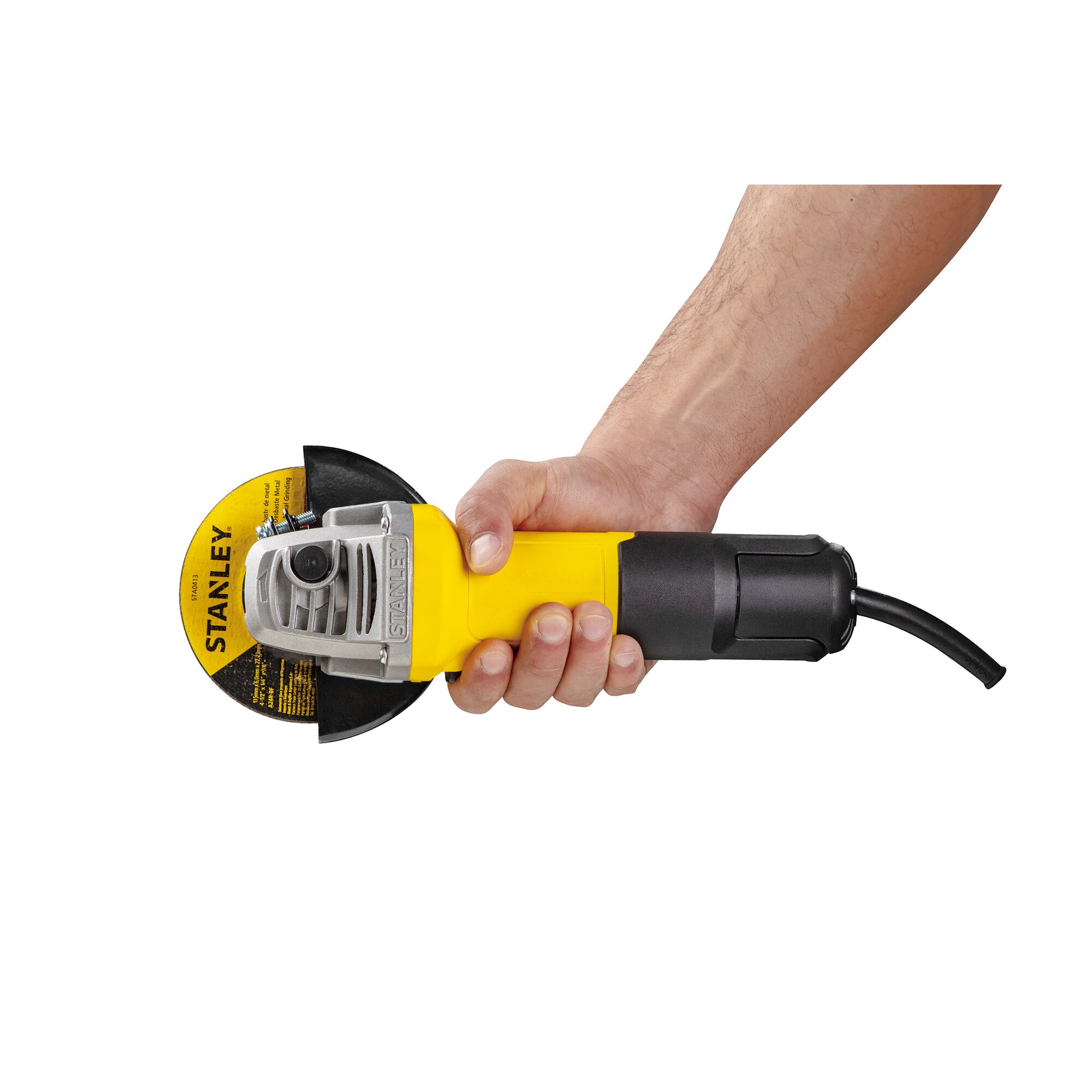 Photo of STANLEY SG7100 angle grinder in a hand, yellow and black body, side view, power cable visible.