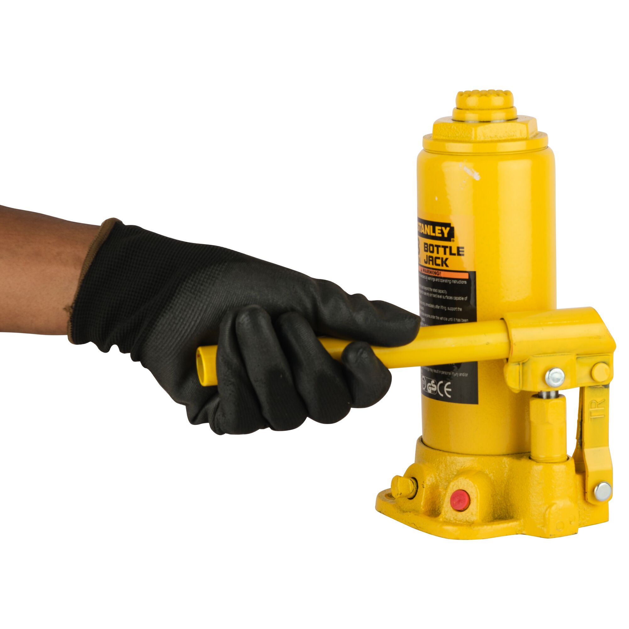 Photo of STANLEY ST90801CE bottle jack being operated by a gloved hand, yellow color, product side view.