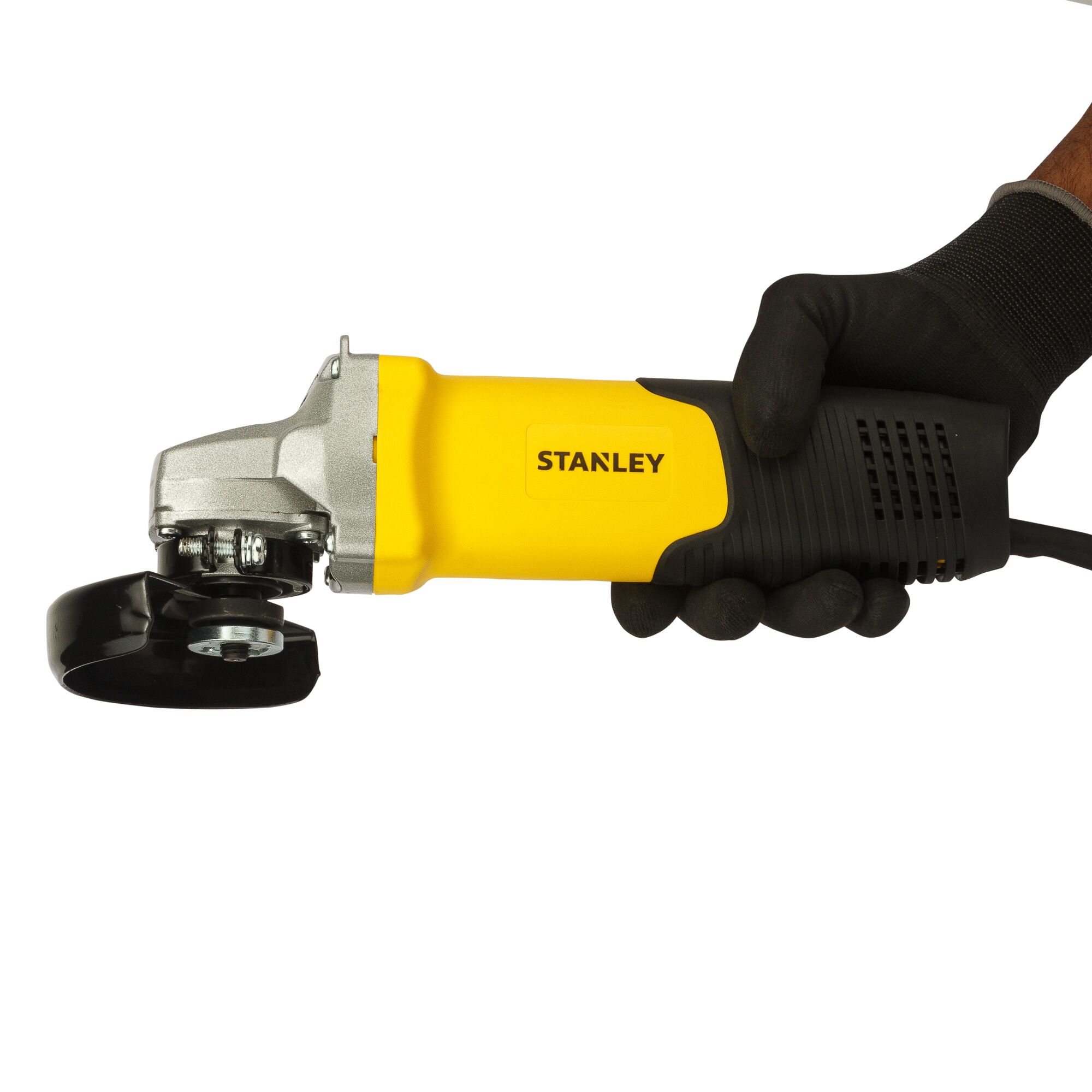 Photo of STANLEY STGT8100 yellow and black angle grinder held in a gloved hand, side view.