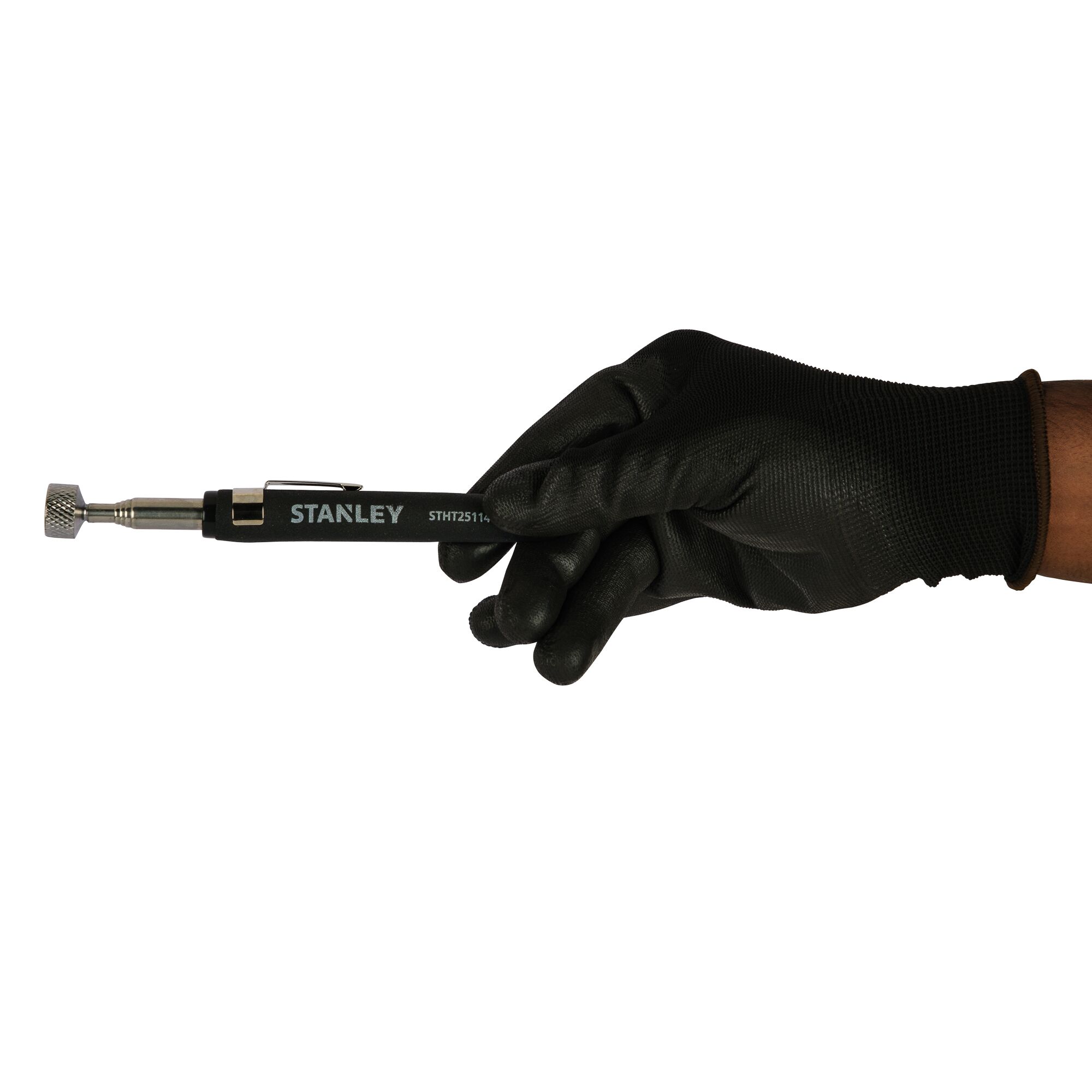 Photo of STANLEY STHT25114-0 magnetic pickup tool held by a gloved hand, side angle, black handle.