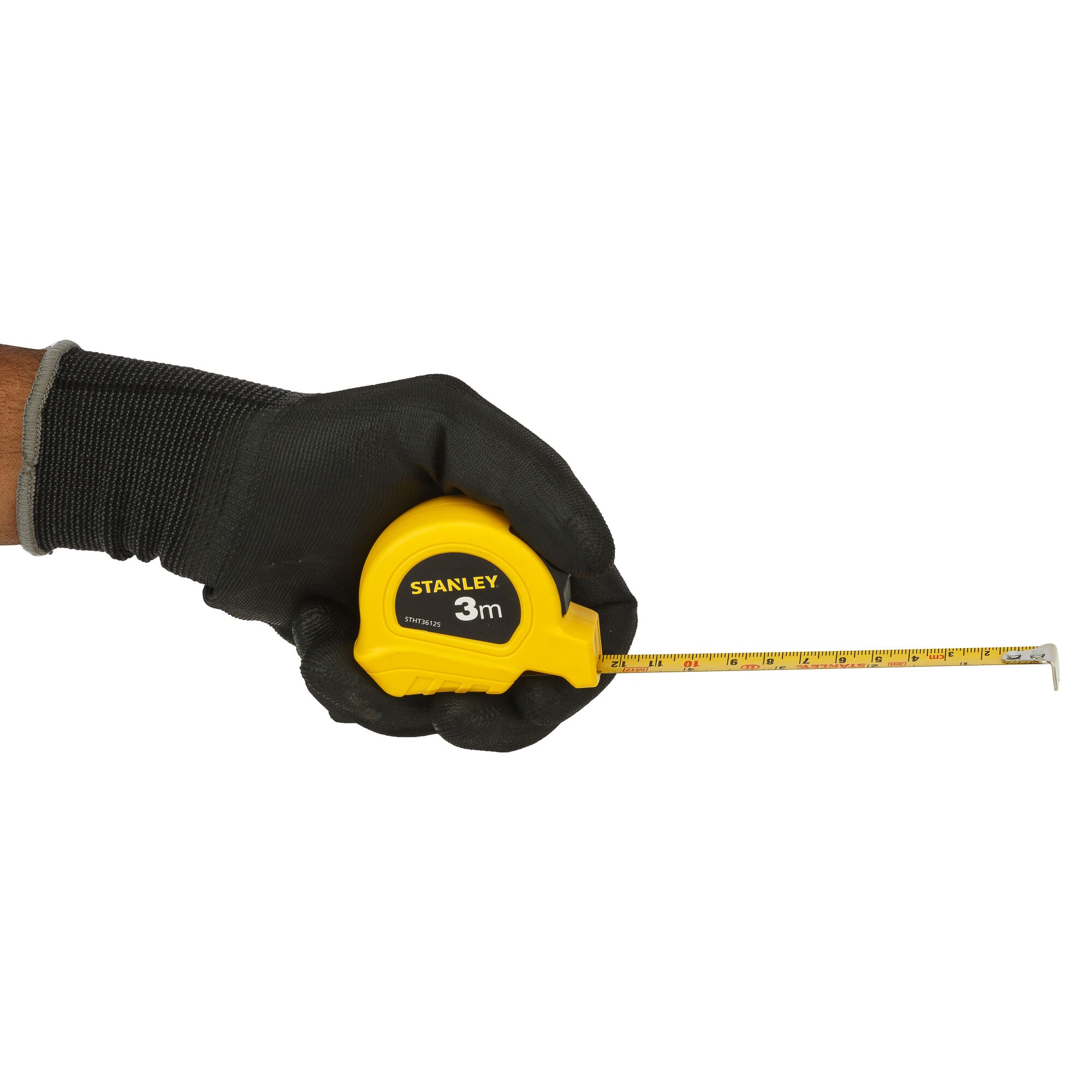 Photo of STANLEY STHT36125-812 yellow tape measure held in a gloved hand, extended on white background.