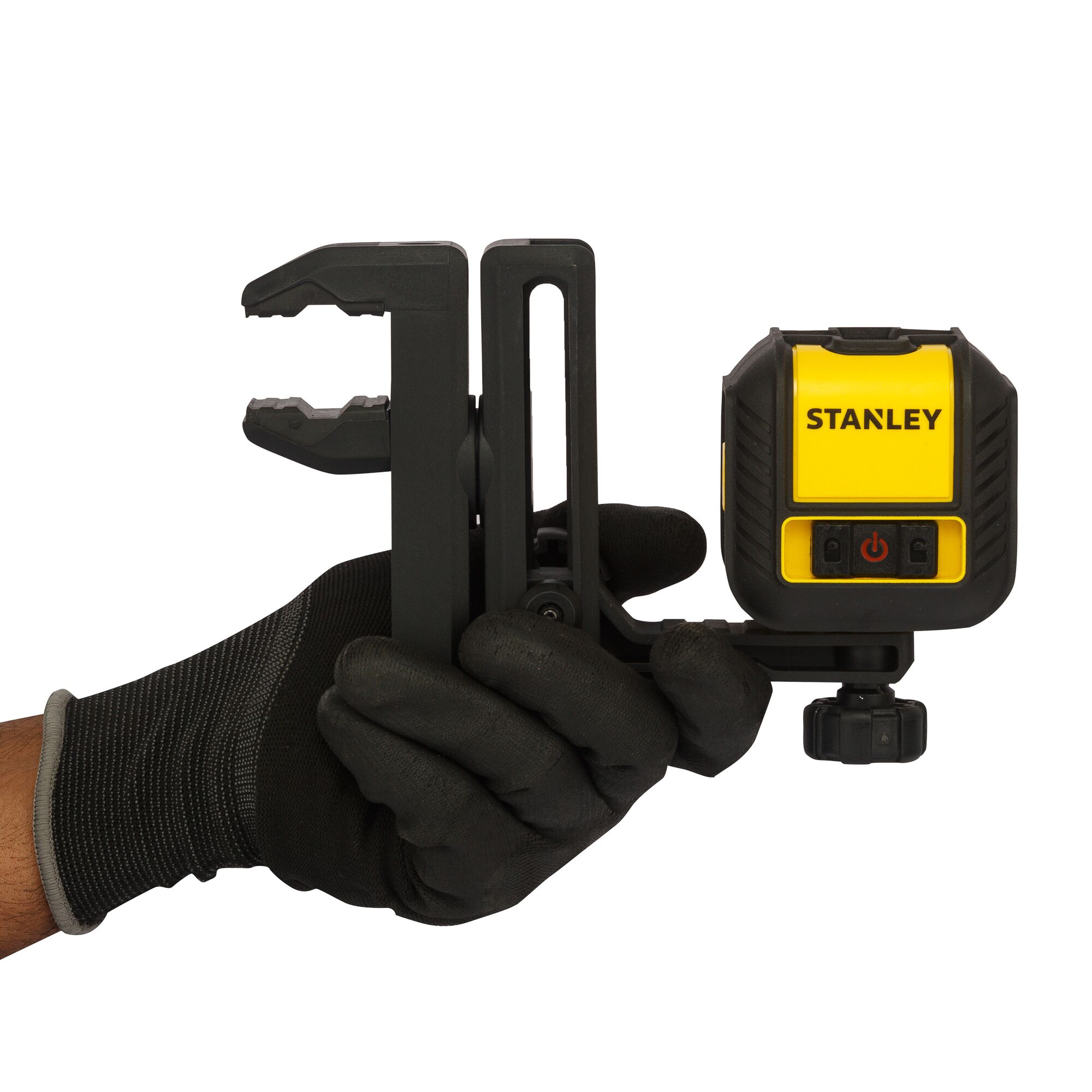 Photo of STANLEY STHT77498-1 laser level with clamp, held in gloved hand, front angle.