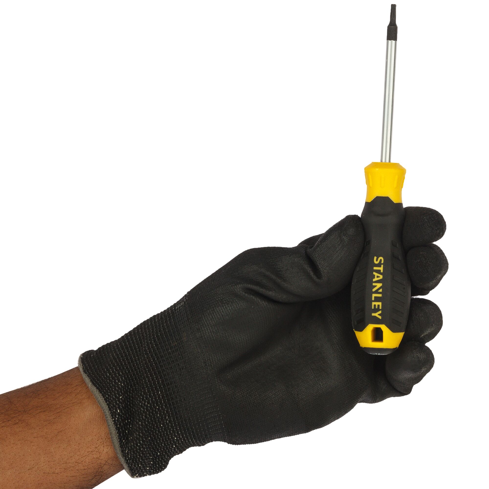 Stanley STMT60844-8 screwdriver with yellow-black handle held in gloved hand, photographed side angle.