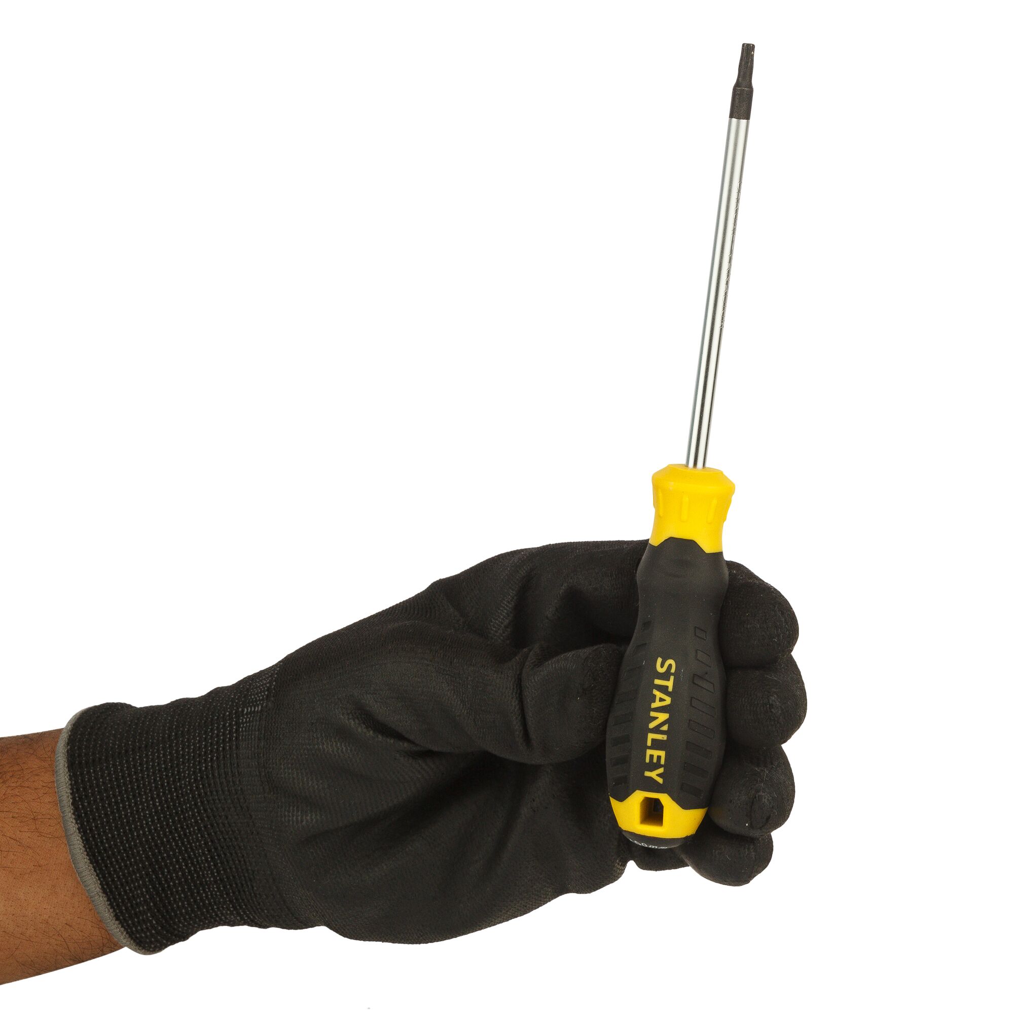 A gloved hand holds a STANLEY screwdriver with a yellow and black handle, viewed against a plain white background.