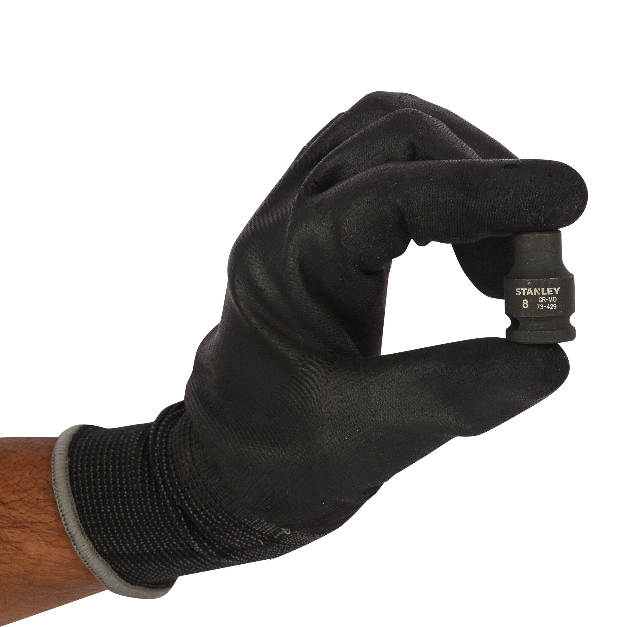 Photo of STANLEY STMT73429-8B socket held by gloved hand, front angle, black finish.
