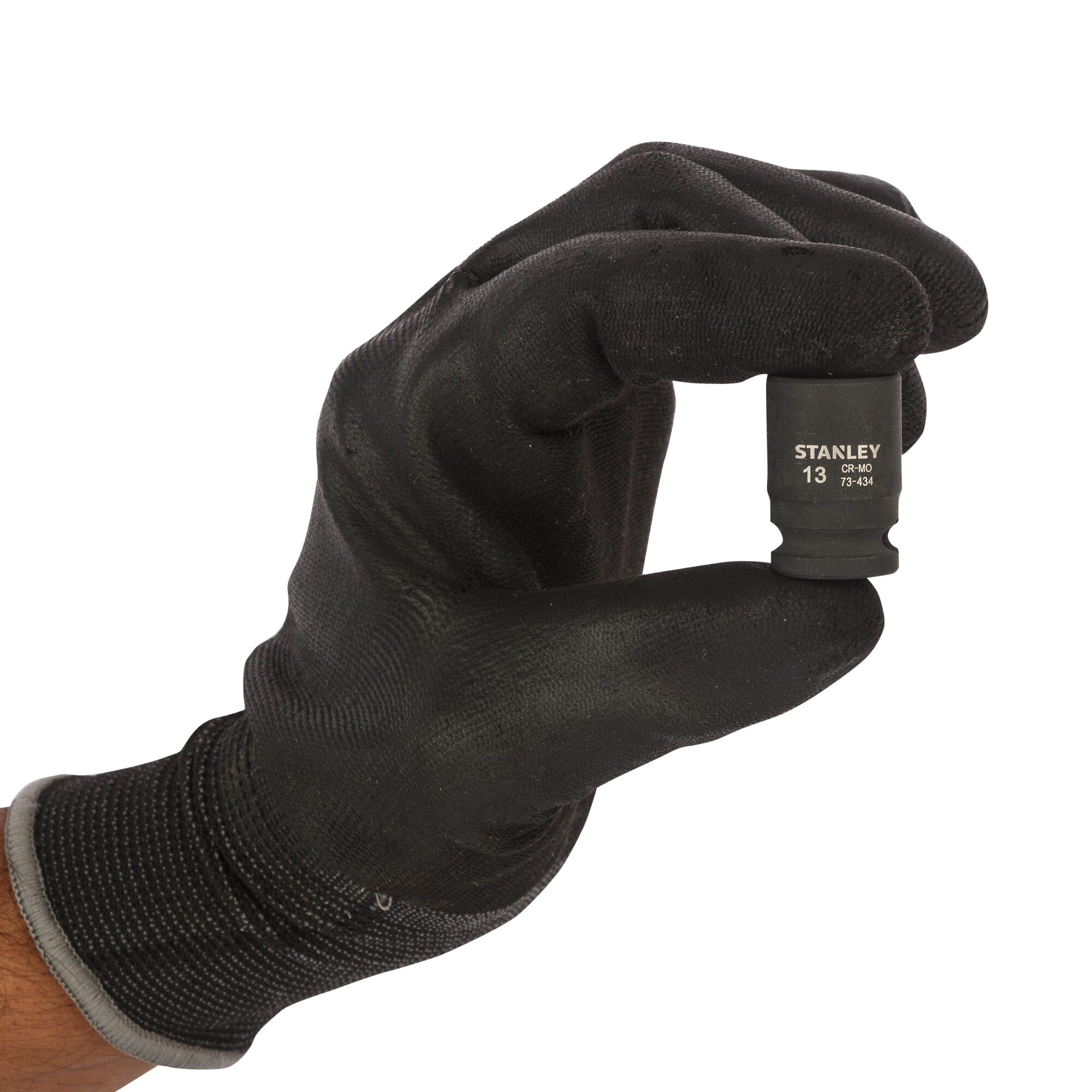 STANLEY STMT73434-8B socket held by gloved hand, black finish, front angle, photography.