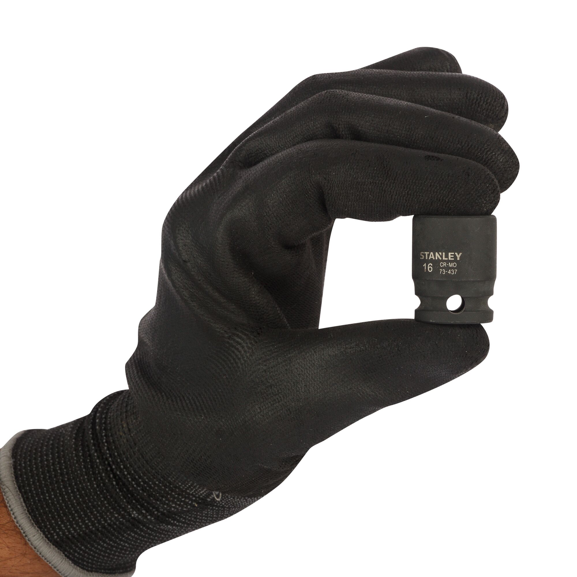 Photo of STANLEY STMT73437-8B socket held by a gloved hand, close-up, white background.