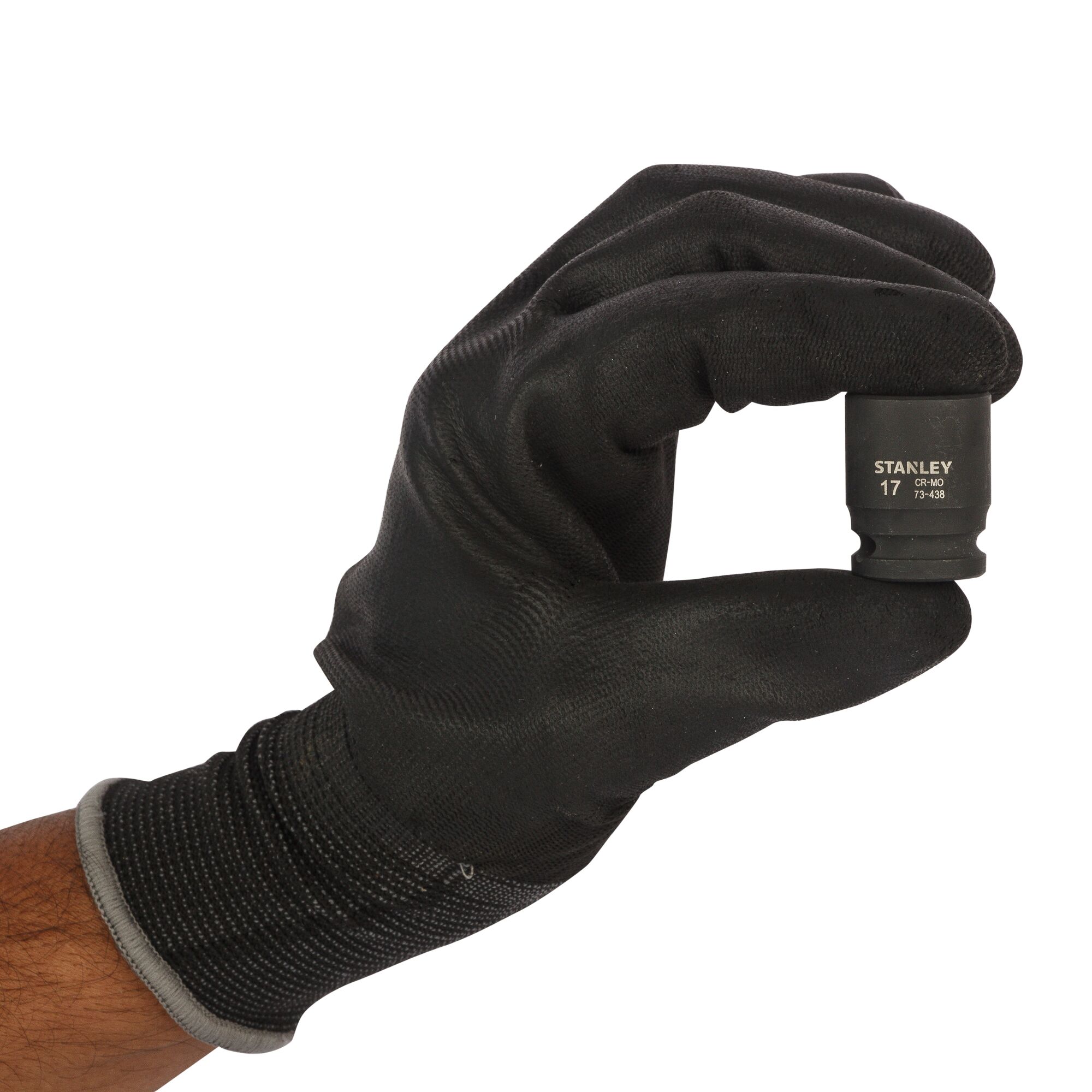 Gloved hand holding a Stanley 17mm socket tool against a white background.