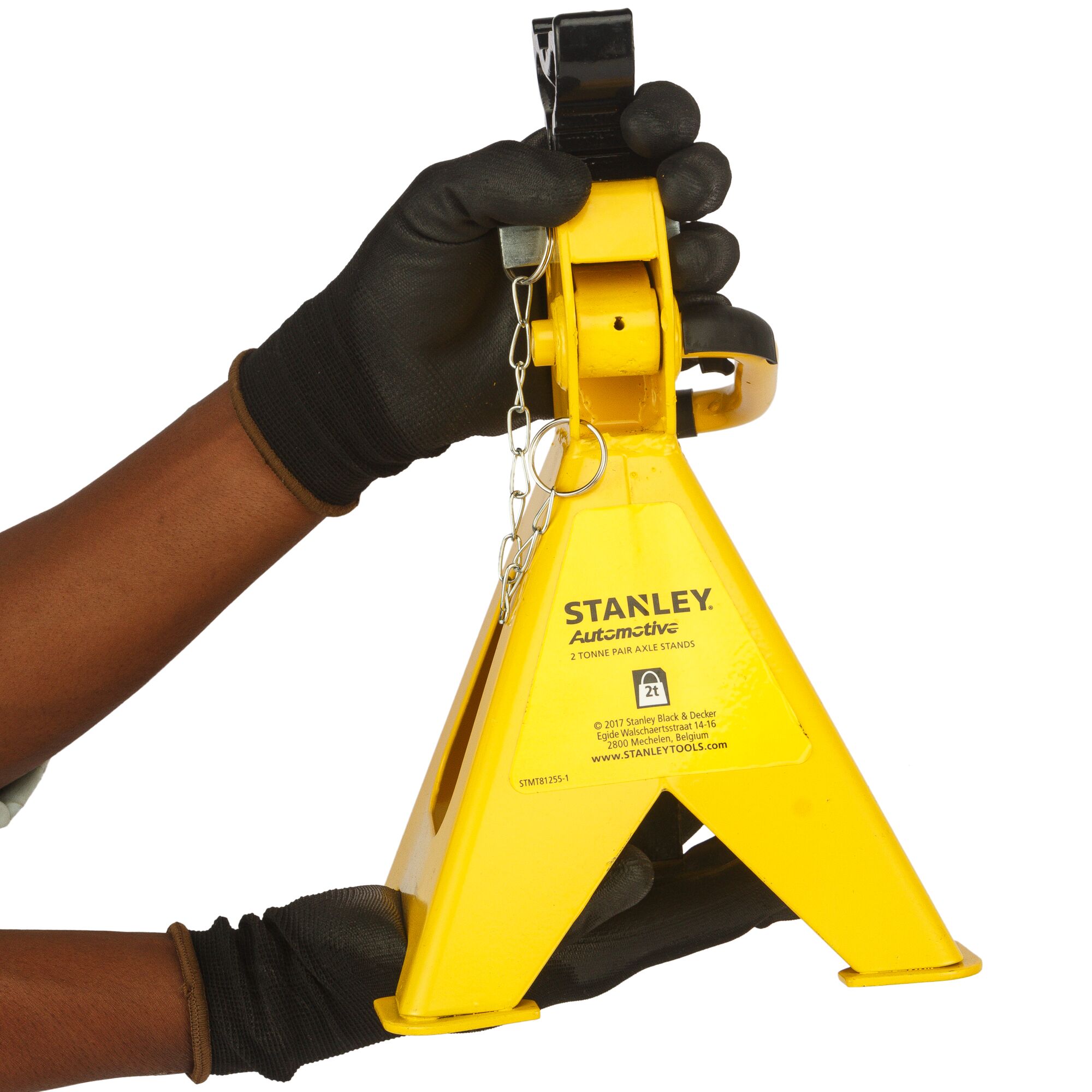 STANLEY STMT81255-1 yellow automotive axle stand held by gloved hands, close-up angle.