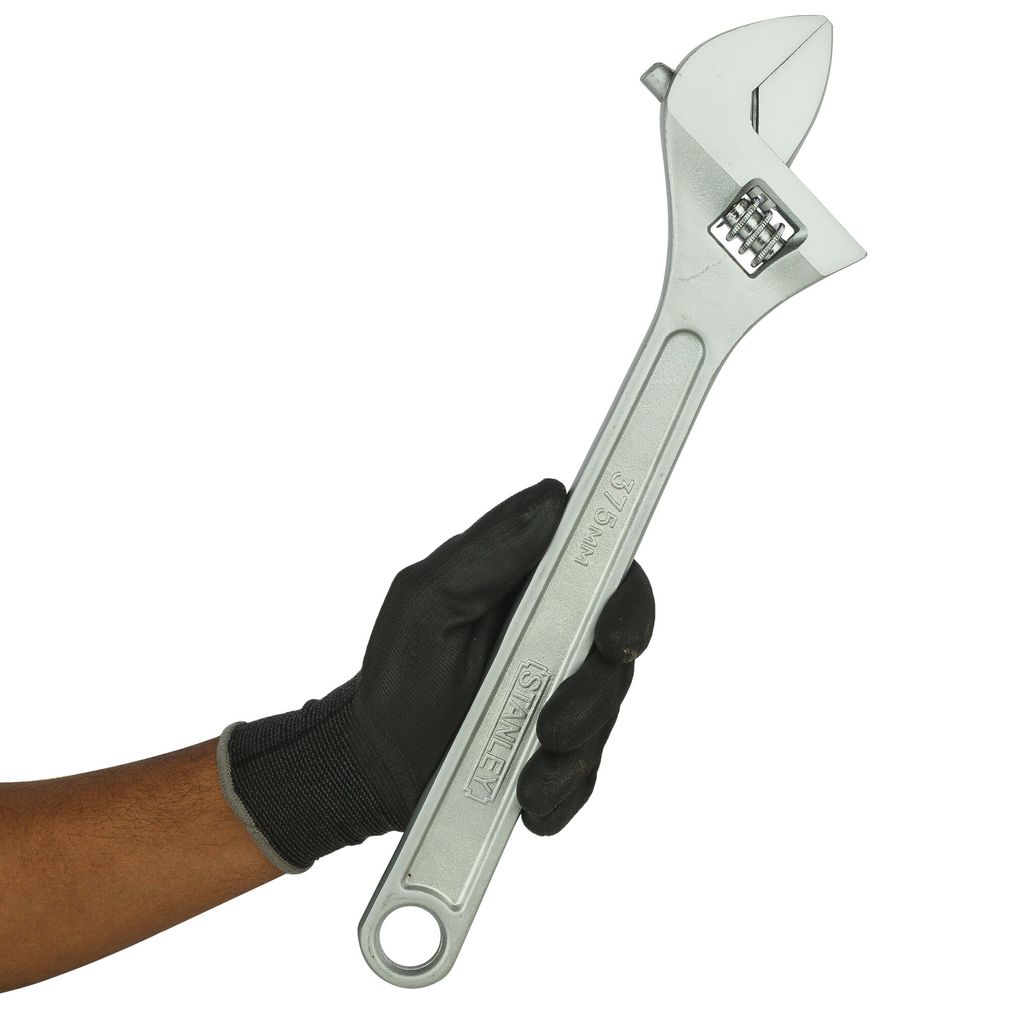 Photo of STANLEY STMT87435-8 adjustable wrench held in gloved hand, silver finish, left side view.