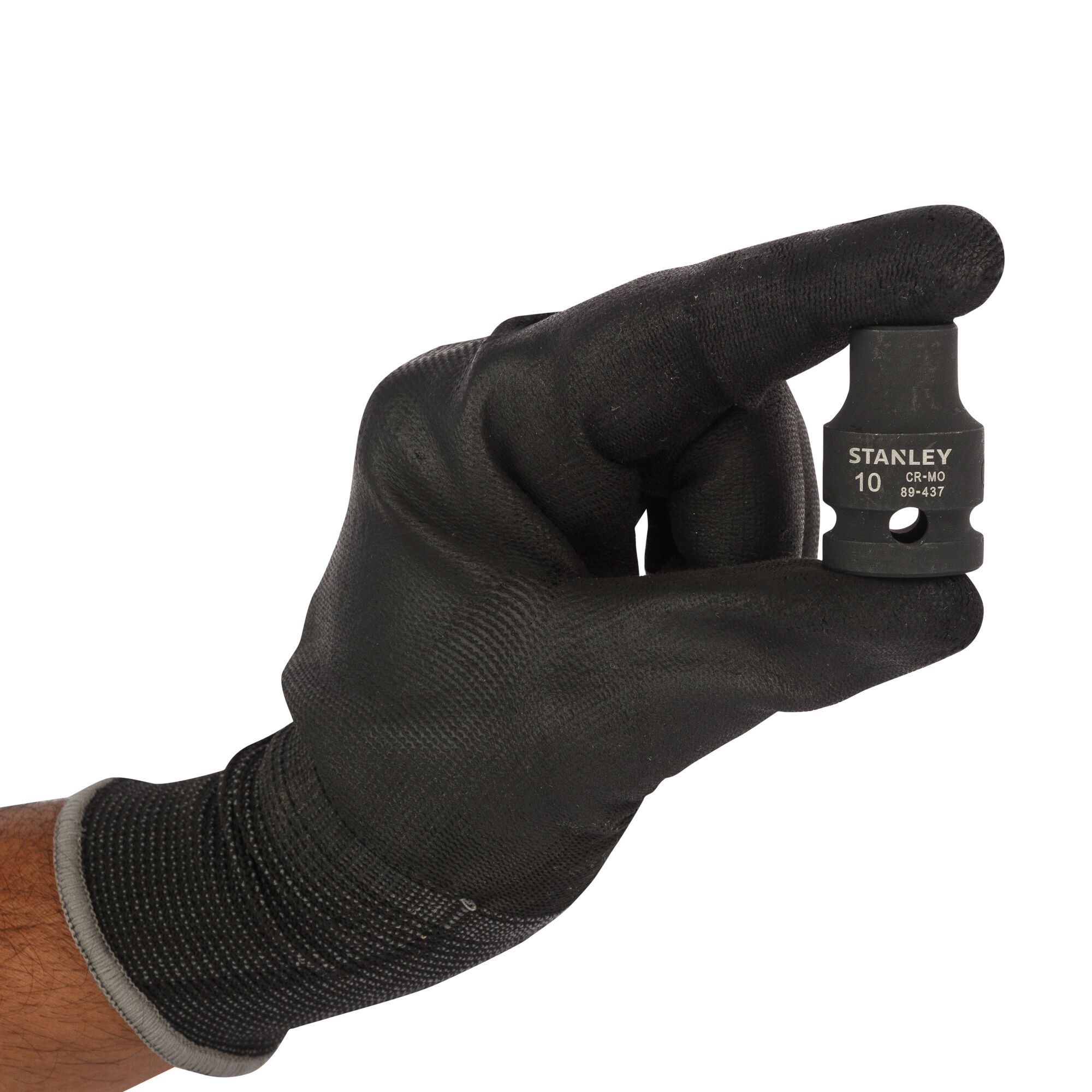 Photo of STANLEY STMT89437-8B socket held by gloved hand, black tool with printed markings.
