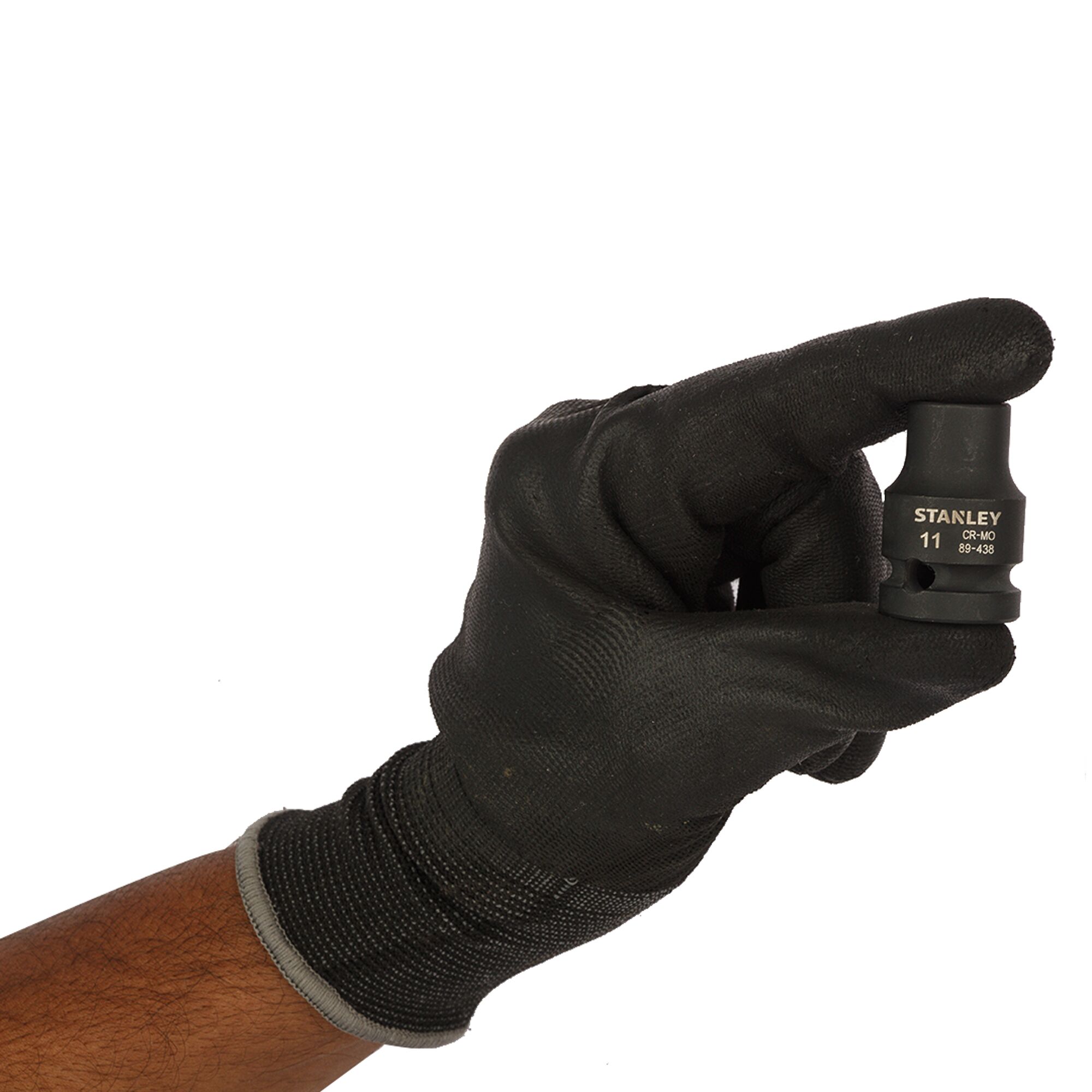 STANLEY STMT89438-8B socket held by a hand wearing a black glove, close-up on white background.