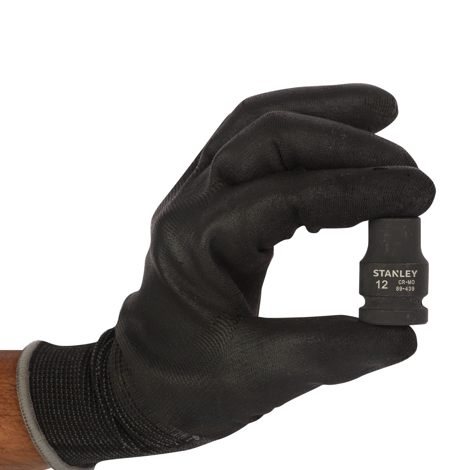 Photo of STANLEY STMT89439-8B socket tool held by a gloved hand, front angle, black finish.