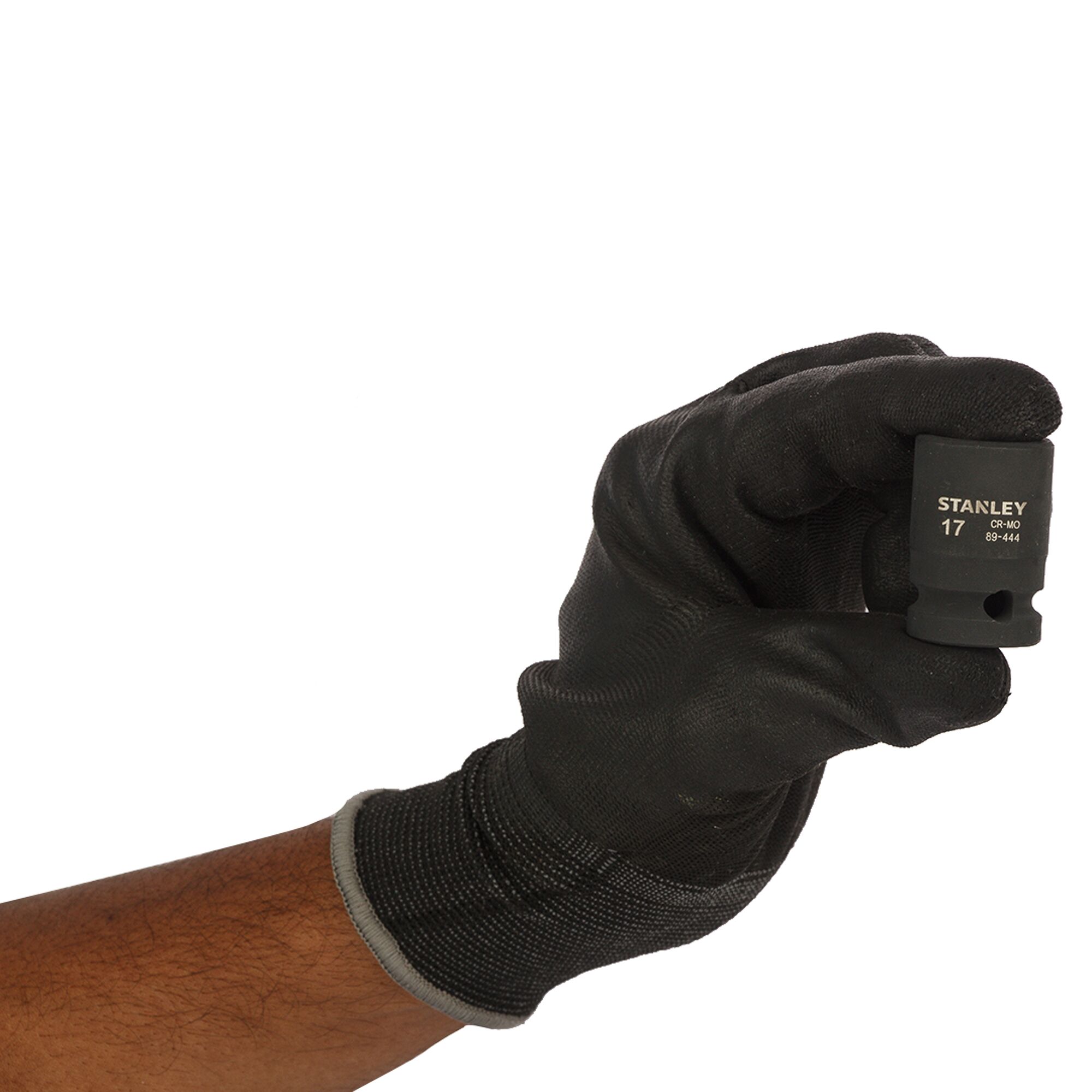 Photo of STANLEY STMT89444-8B socket held by a gloved hand, black finish, product category photography