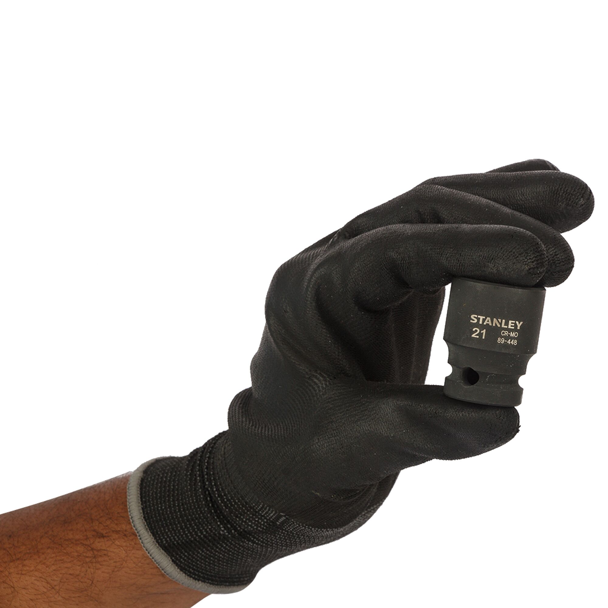 Photo of STANLEY STMT89448-8B socket held by a gloved hand, black industrial finish, front angle.