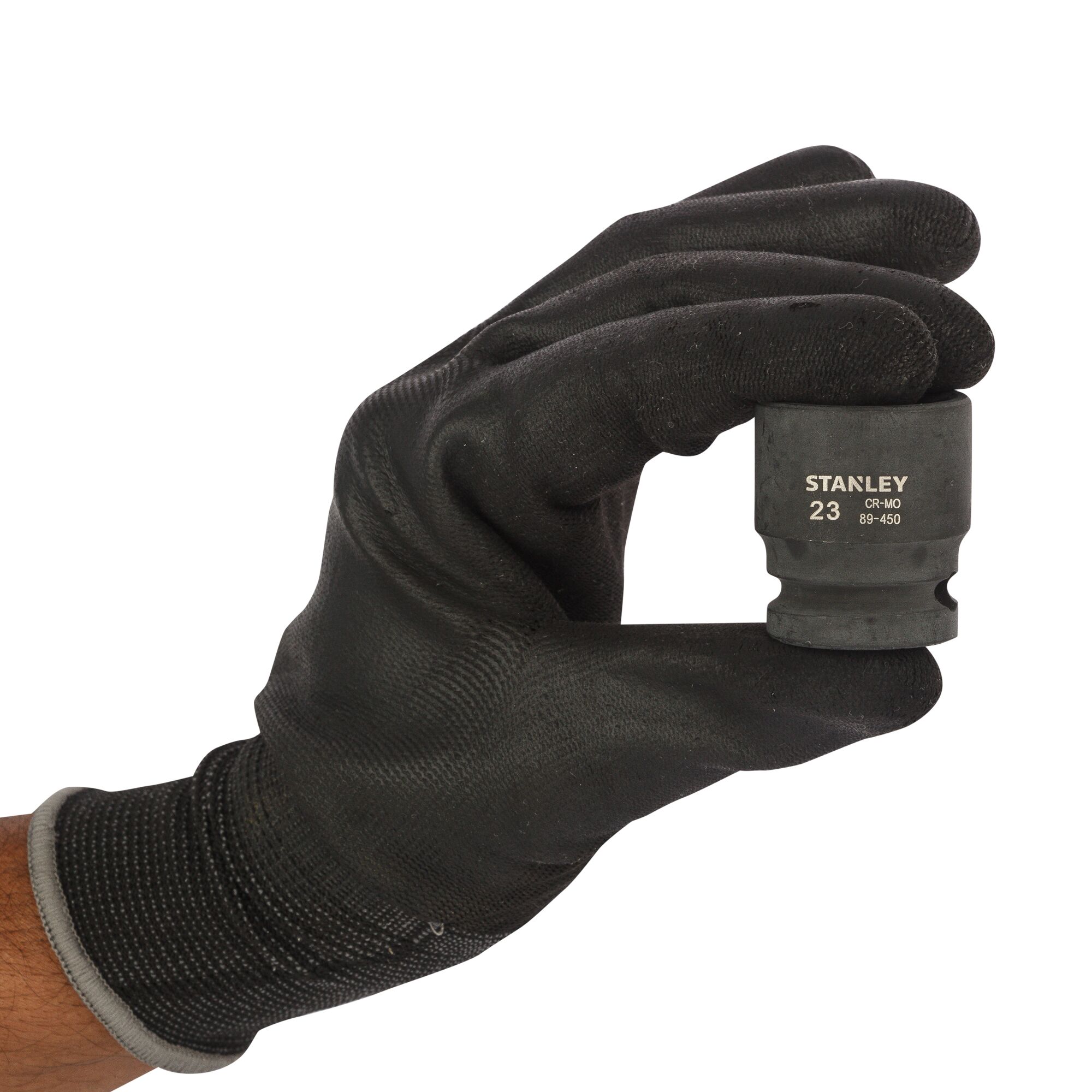 Photo of STANLEY STMT89450-8B socket held in a black-gloved hand, front view, socket features clear markings.