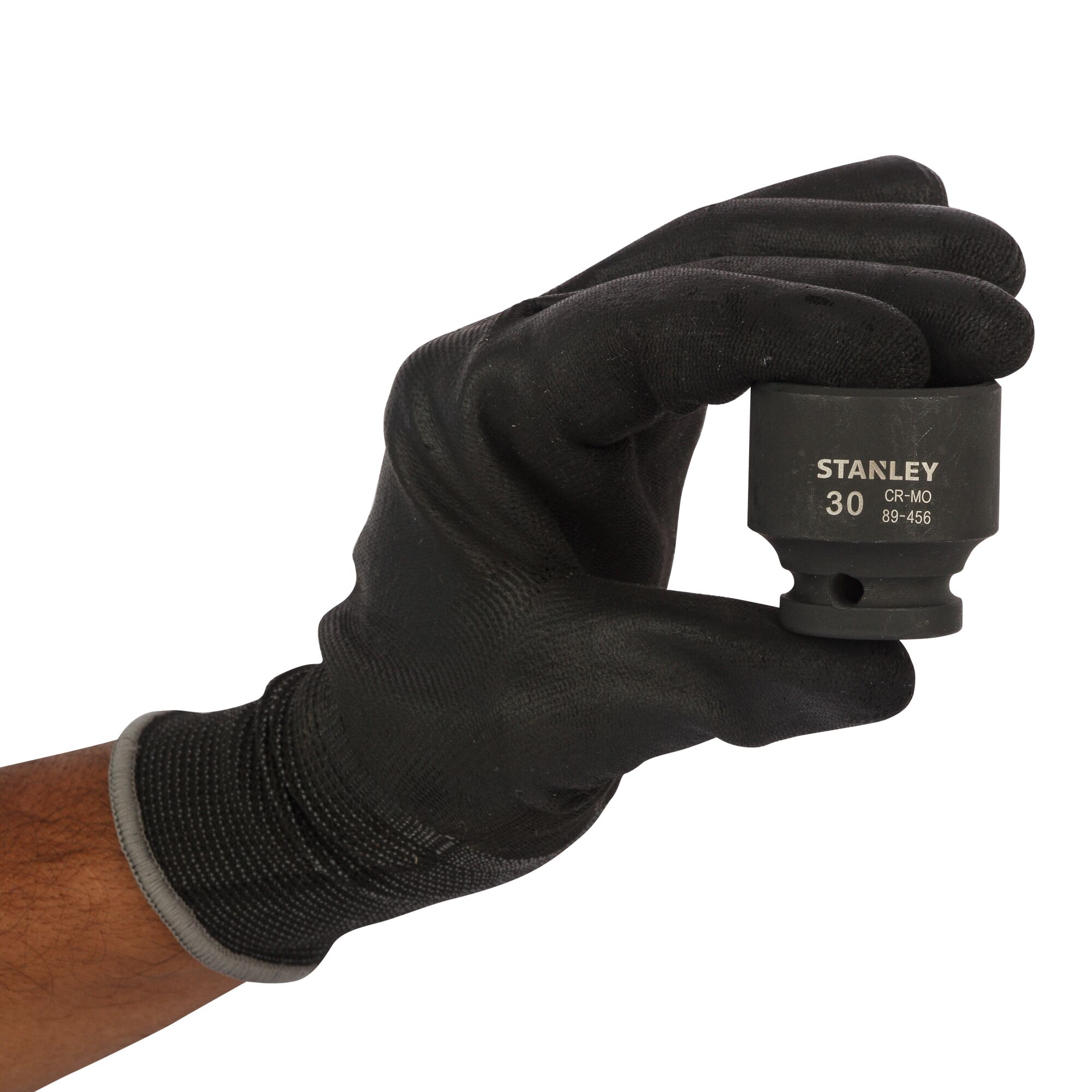 Photo of STANLEY STMT89456-8B impact socket held in a gloved hand, black finish, product front view.