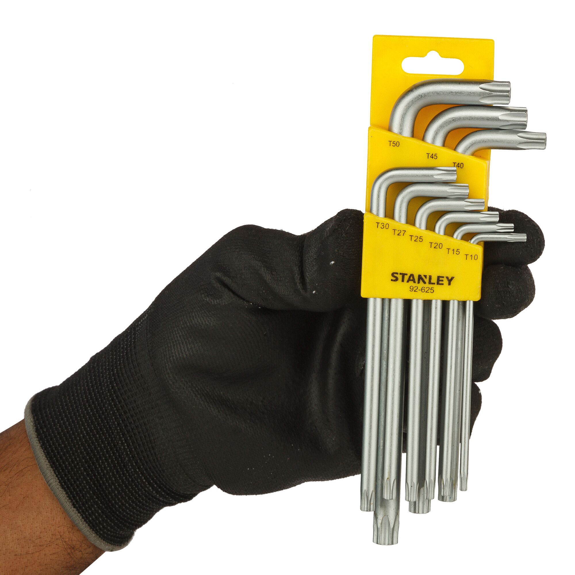 Photo of STANLEY STMT92625-8 Torx key set in yellow holder, held by a gloved hand, front angle.