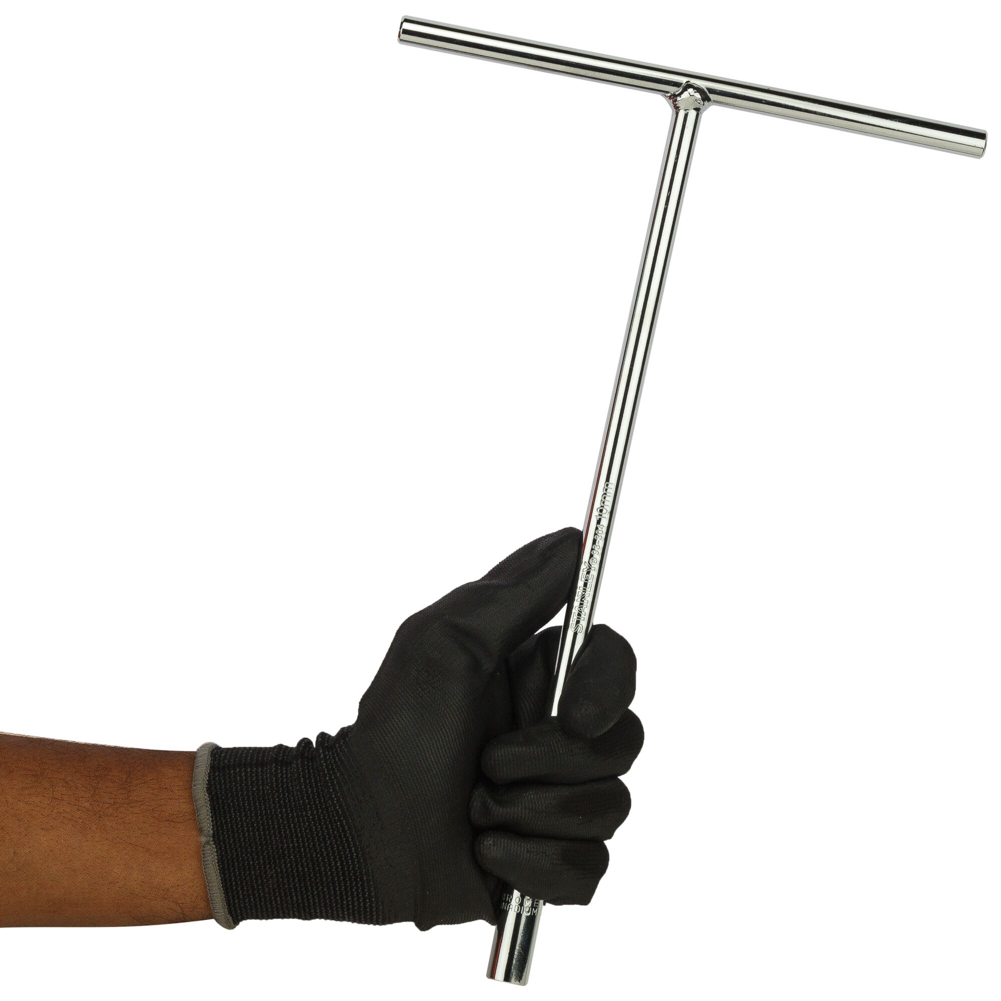 Gloved hand holding a shiny, metal T-handle tool against a plain white background.