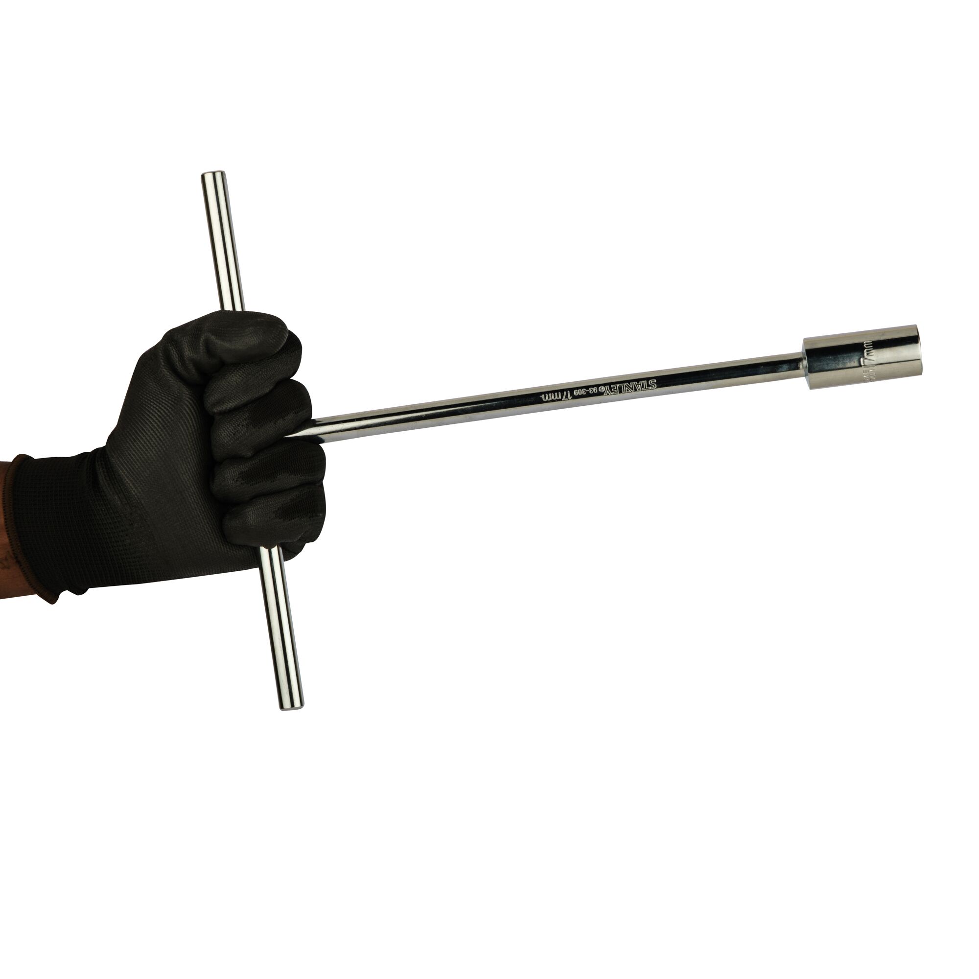 A black-gloved hand holding a Stanley T-handle socket wrench against a white background.